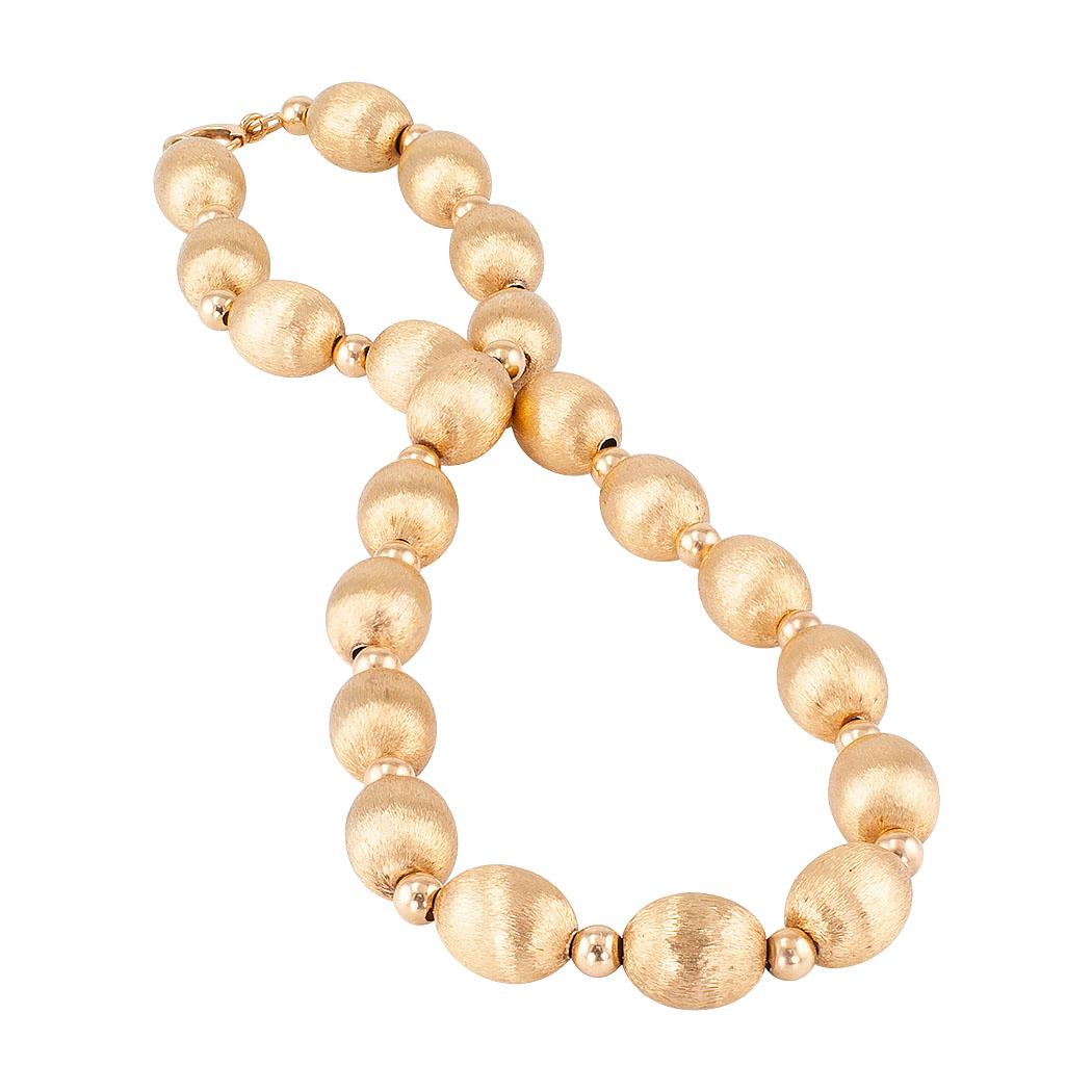 Yellow gold bead necklace circa 1950.
DETAILS:
Florentine yellow gold bead necklace.
METAL: 14-karat yellow gold.
MEASUREMENTS: approximately 15” long and 3/8” wide overall.
Very pristine condition consistent with age and wear.

We invite you to