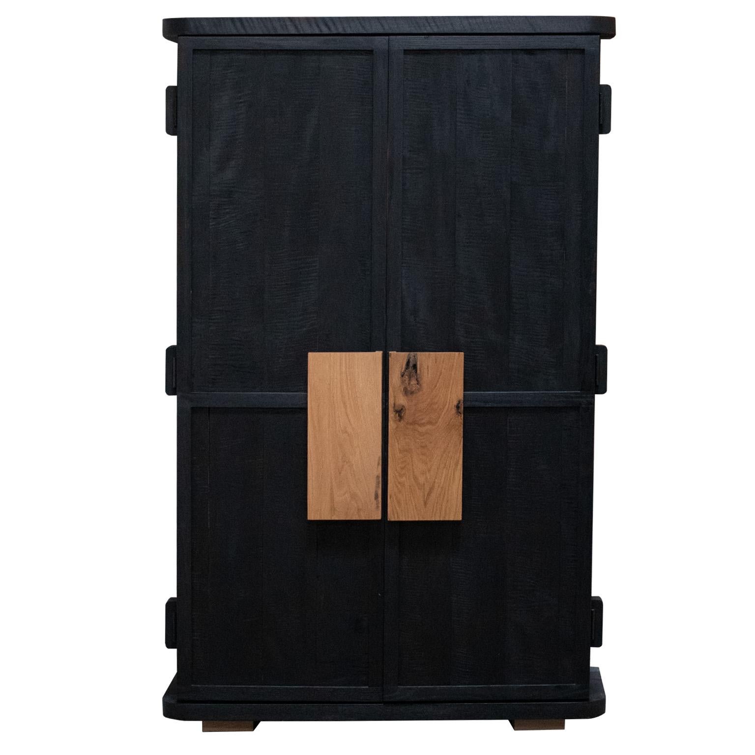 Elevate your space with the luxurious Florentino Black Cabinet. Expertly crafted from premium figured maple, white oak, and walnut woods, this hand made armoire is a stunning piece of furniture that will captivate your guests. The interior is