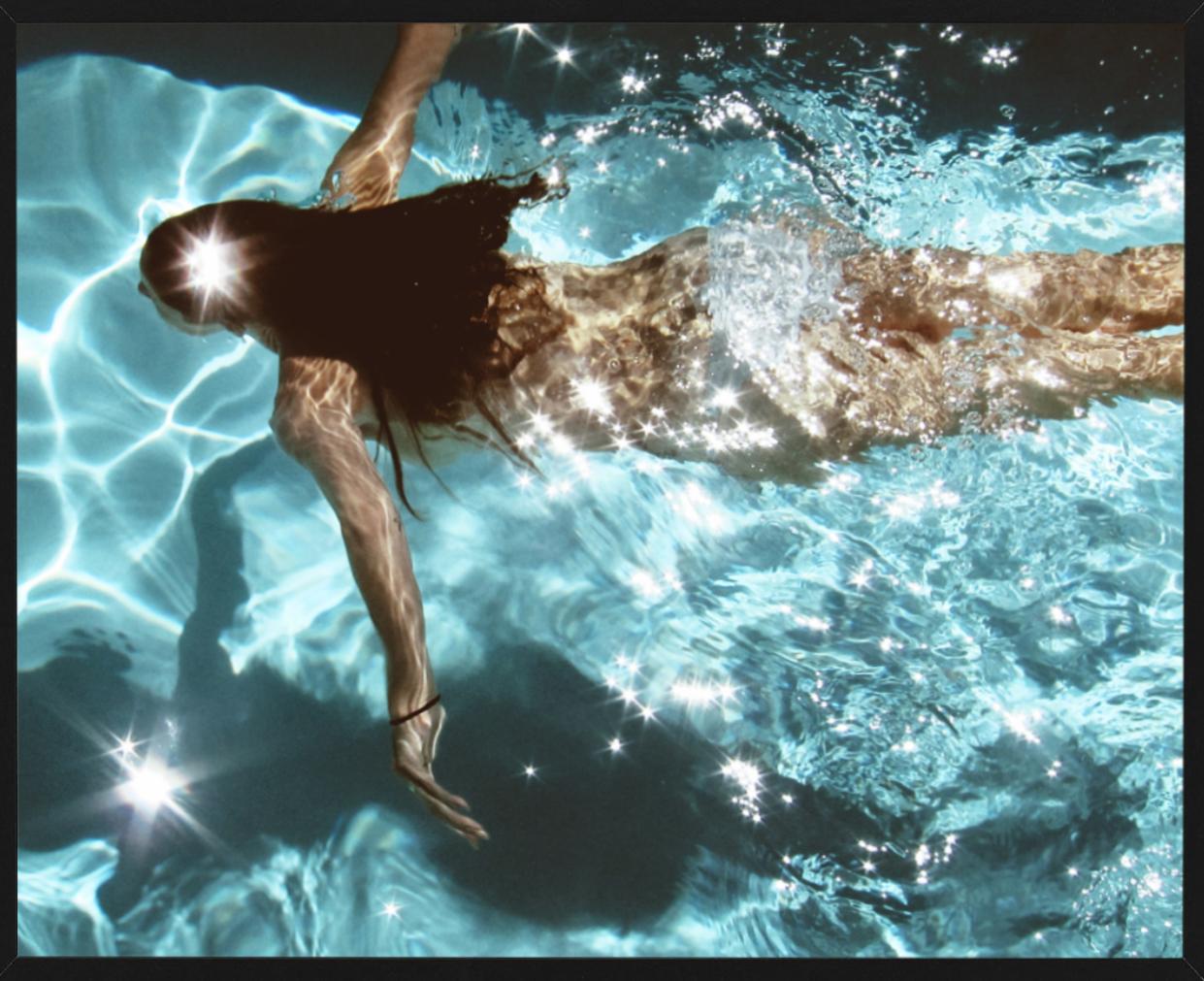 La Piscina, Capri - Naked woman in pool swimming underwater - Photograph by Florian Innerkofler