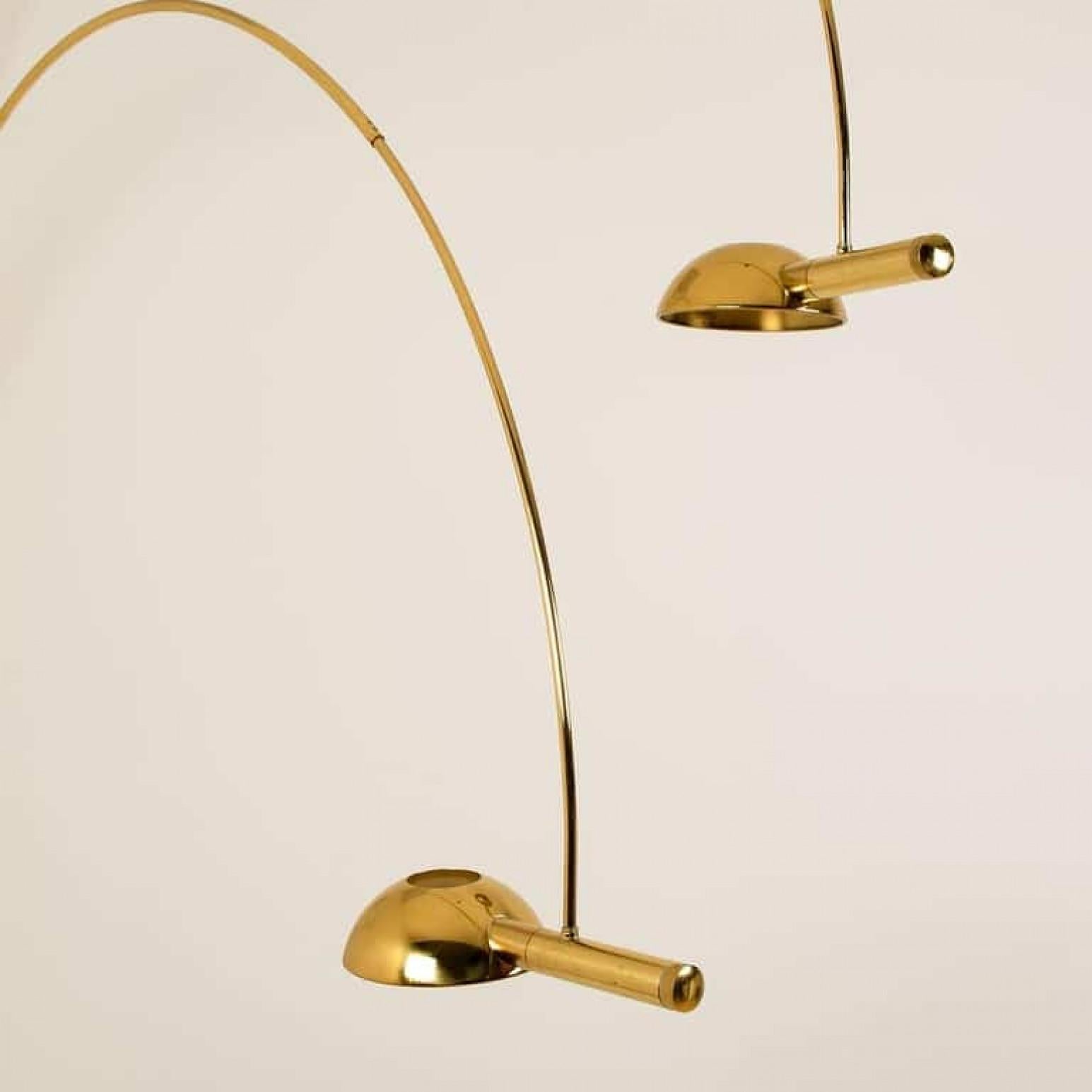 An exceptional, rare to find giant double ball floor lamp by Florian Schulz, Germany, 1970. This lamp is adjustable and can be pivoted in multiple positions, it is being designed for easily being clamped between ground and ceiling. It is made of