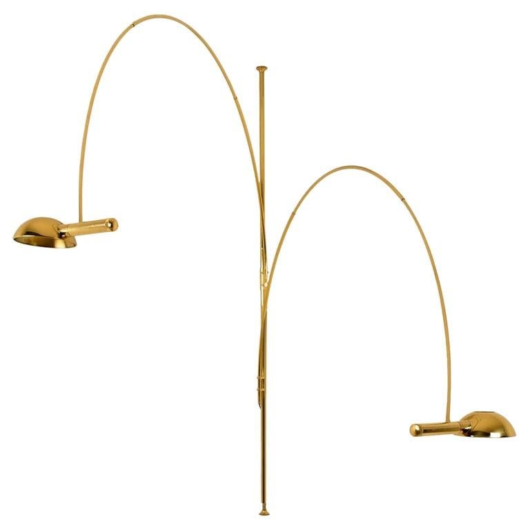 An exceptional, rare to find giant double ball floor lamp by Florian Schulz, Germany, 1970. This lamp is adjustable and can be pivoted in multiple positions, it is being designed for easily being clamped between ground and ceiling. It is made of