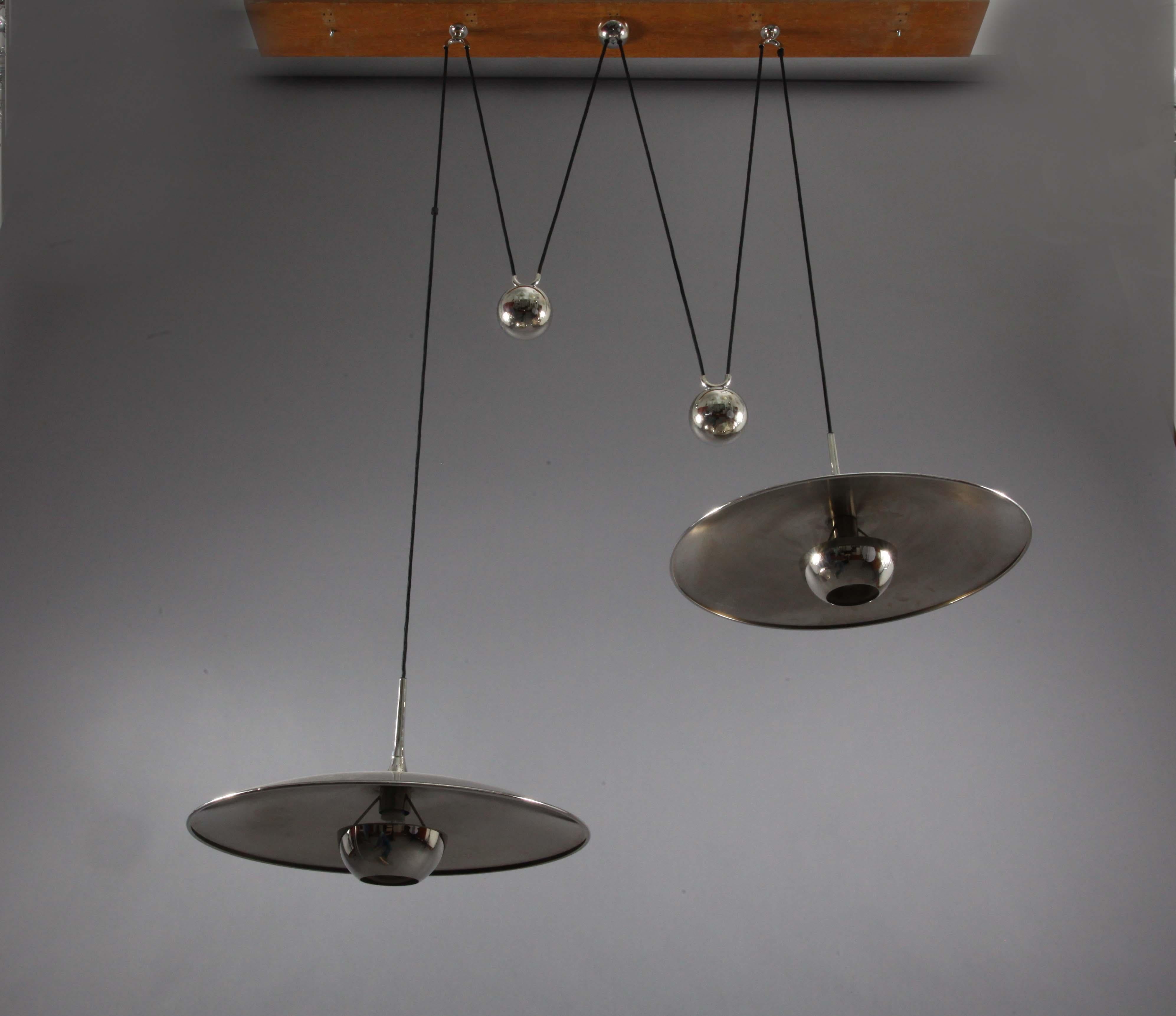 Really beautiful Florian Schulz double Onos 55 pendant lamp with one E27 / model for each lamp and newly wired.
 