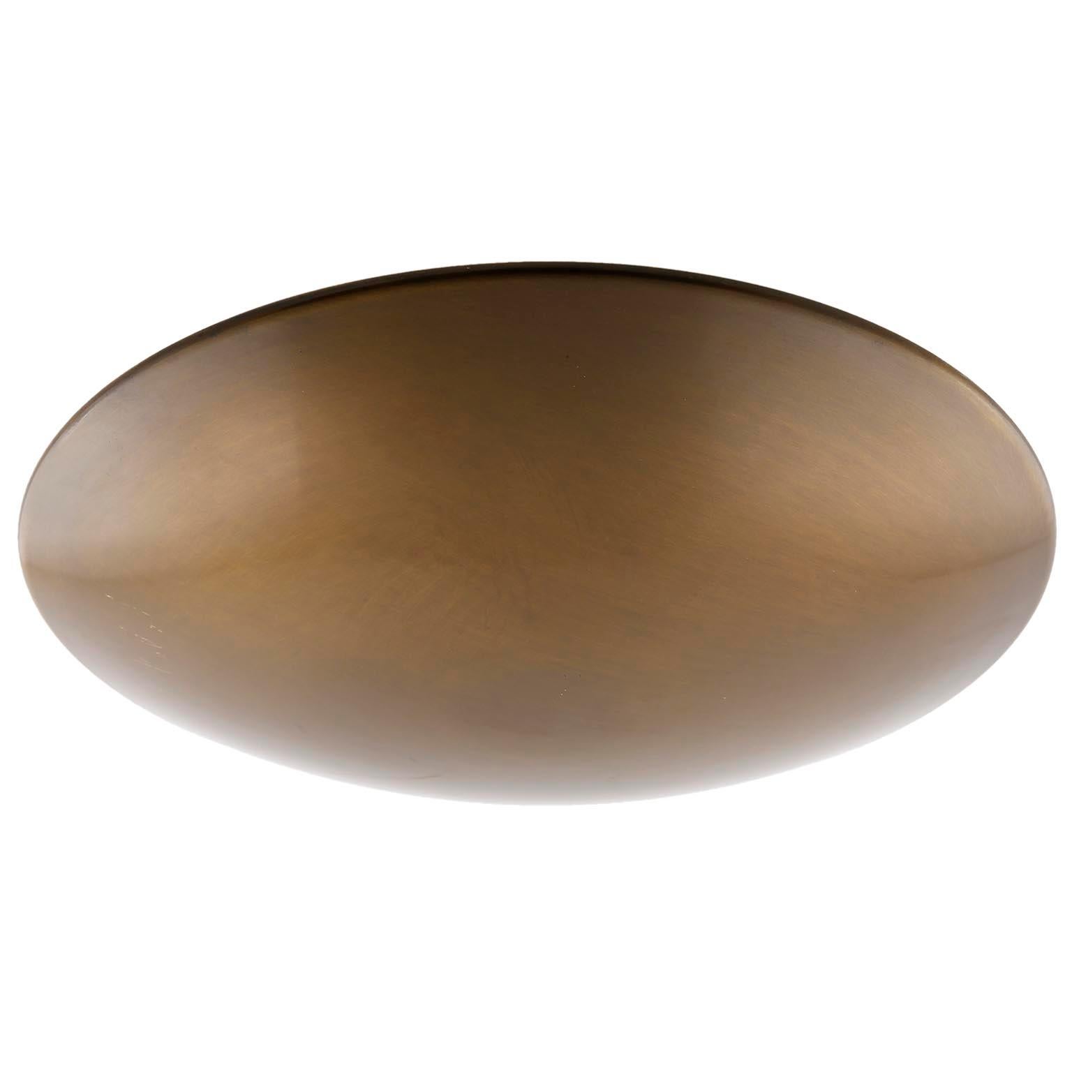 An uplight bowl ceiling light fixture by Florian Schulz, Germany, manufactured in midcentury, circa 1970 (late 1960s or early 1970s).
The lamp is made of solid brass with great patina. It takes five small screw base bulbs E14 candelabra.
It is