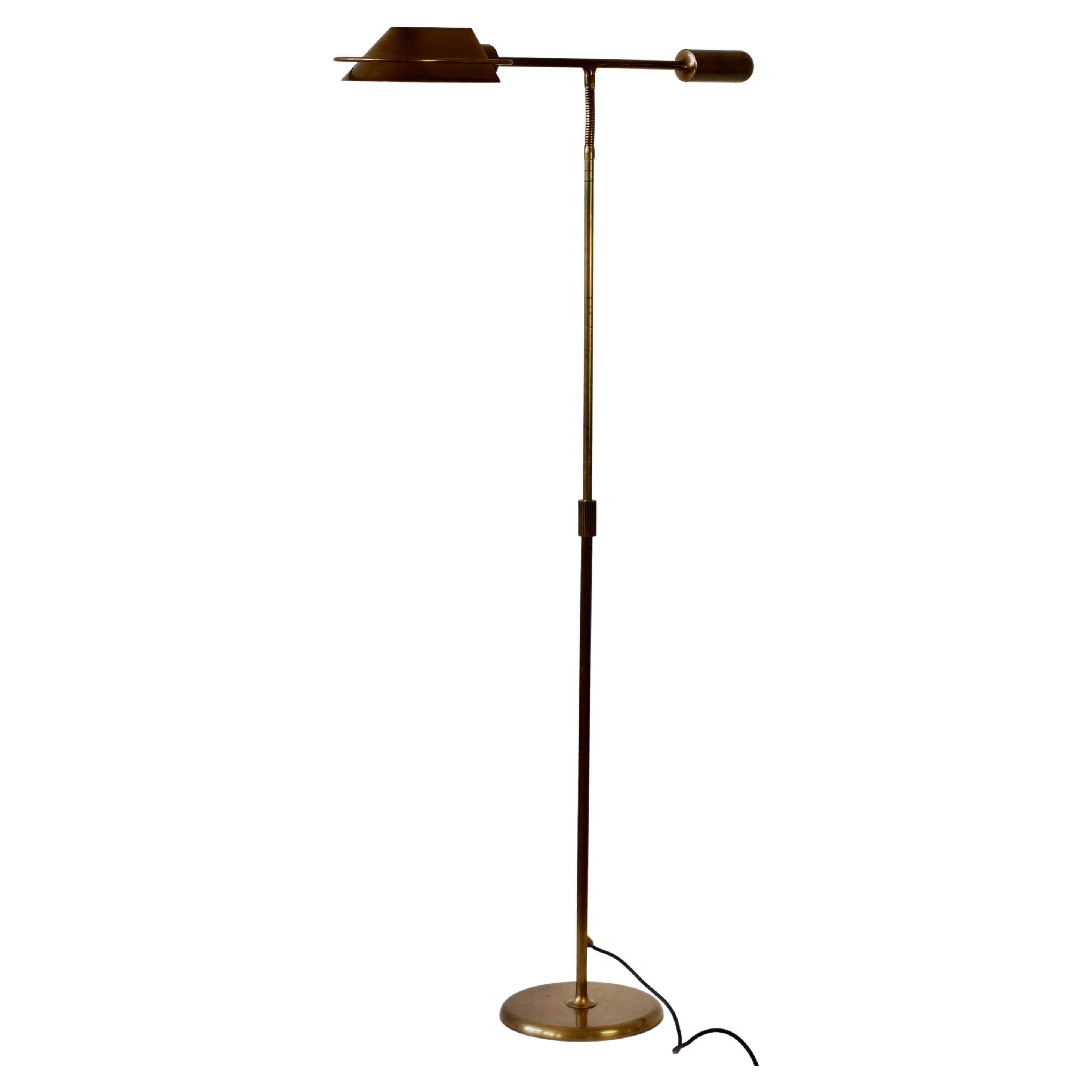 Extremely rare Mid-Century Modern vintage German made dimmable adjustable floor lamp by Florian Schulz circa late 1980s. Featuring a lacquered matt brushed brass finish with an adjustable shade and flexible neck making this the perfect modernist
