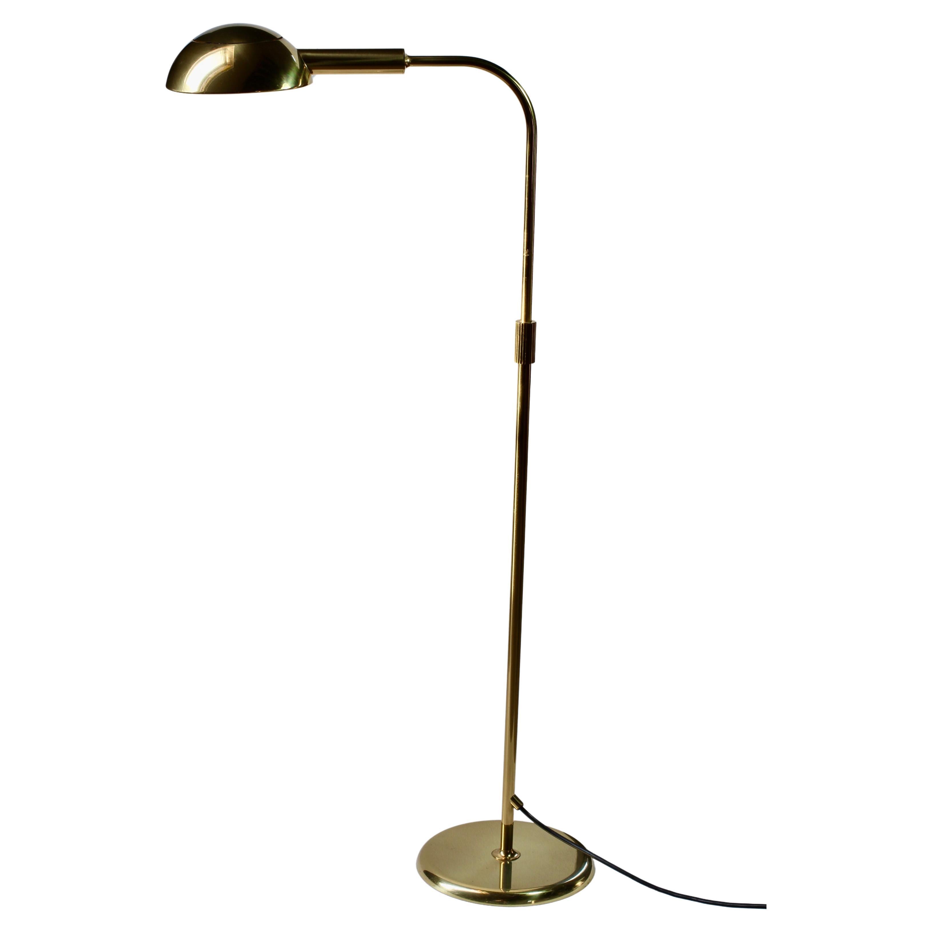 Rare Mid-Century Modern vintage German made dimmable floor lamp by Florian Schulz circa late 1970s -early 1980s. Featuring polished brass (now with age related patina) and height adjustable as is the round brass shade making this the perfect