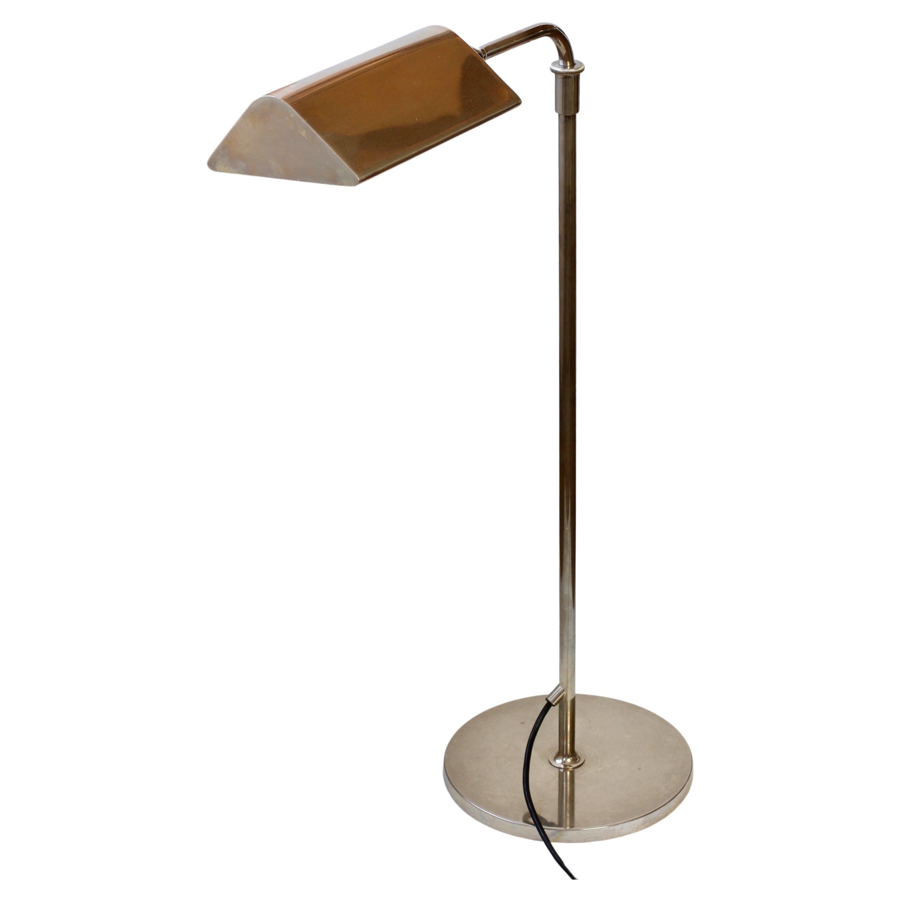 Mid-Century Modern vintage German floor lamp designed by Florian Schulz circa 1970s - this particular example was probably manufactured in the late 1980s and is in excellent vintage condition. Made of polished nickel plated metal, the lamp is height