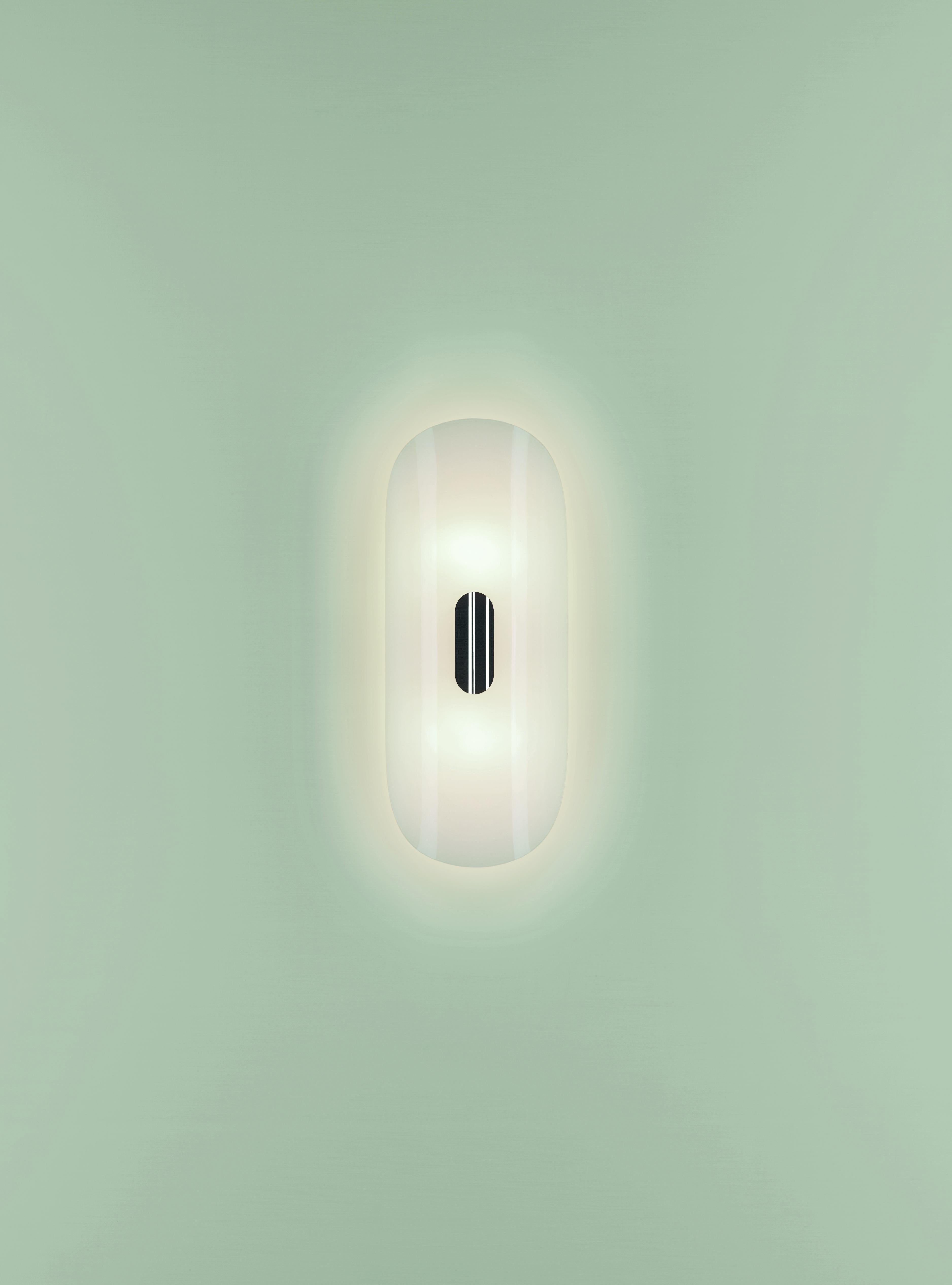 One of a pair of stunning, large and elegant brand new contemporary Mid-Century Modern designed German made polished  brass wall lights or lamps - model 'GEA' - designed by Florian Schulz circa early 1970s. Made of polished brass, this lamp features
