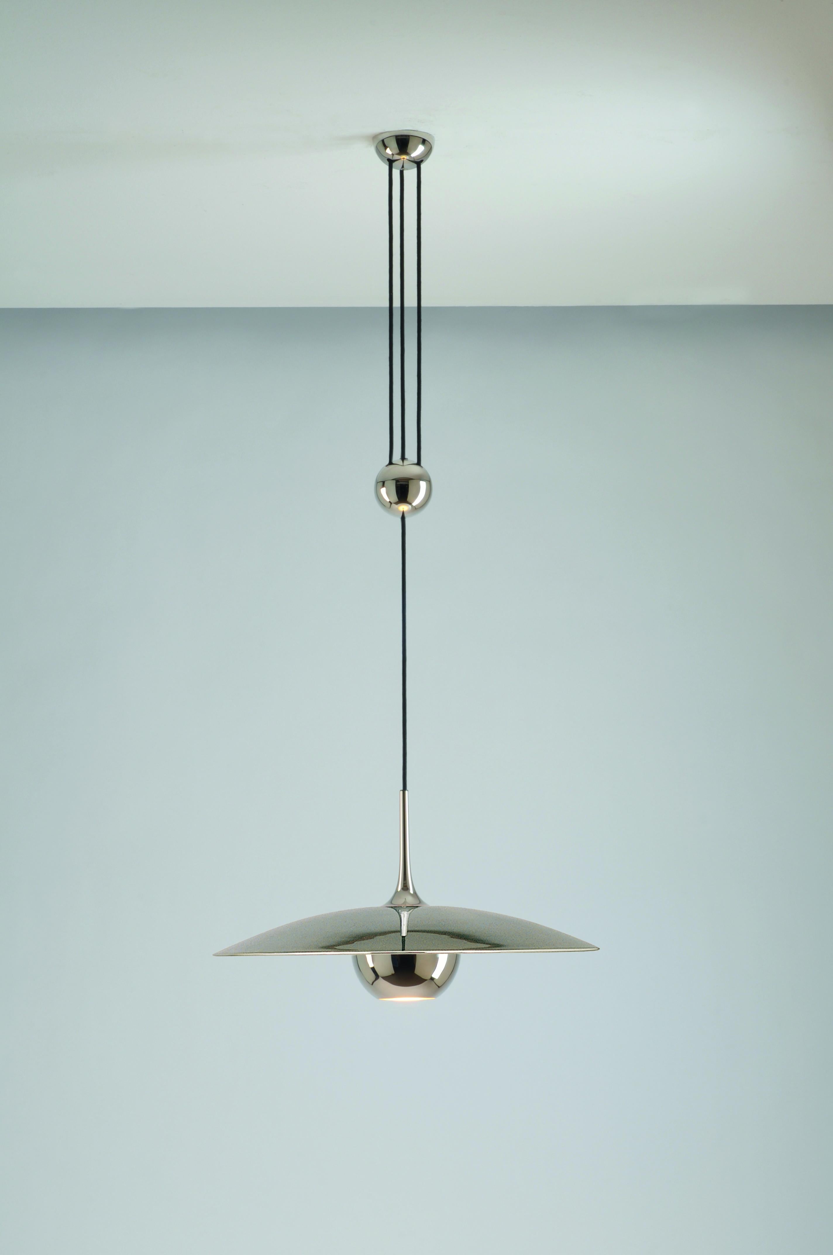 Stunning and elegant brand new contemporary Mid-Century Modern designed German made large polished nickel plated brass adjustable counterweight hanging pendant light or lamp model 'ONOS 55' designed by Florian Schulz circa early 1970s. Made of