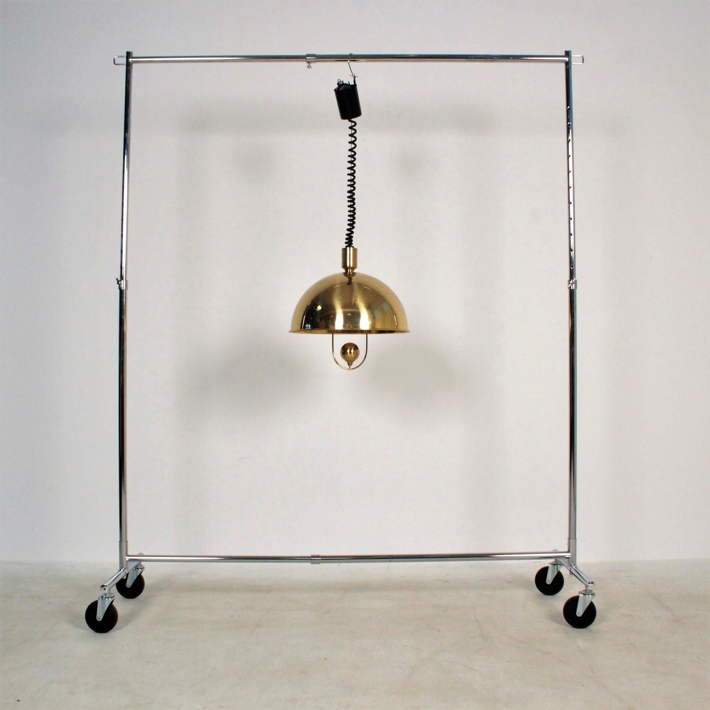 Florian Schulz pendant Brass with weight light, Germany, 1970
Model with a round weight as a deflector for the light
Good condition, some light scratches oil the surface 
This item can be rewired to the specification of your country on request.