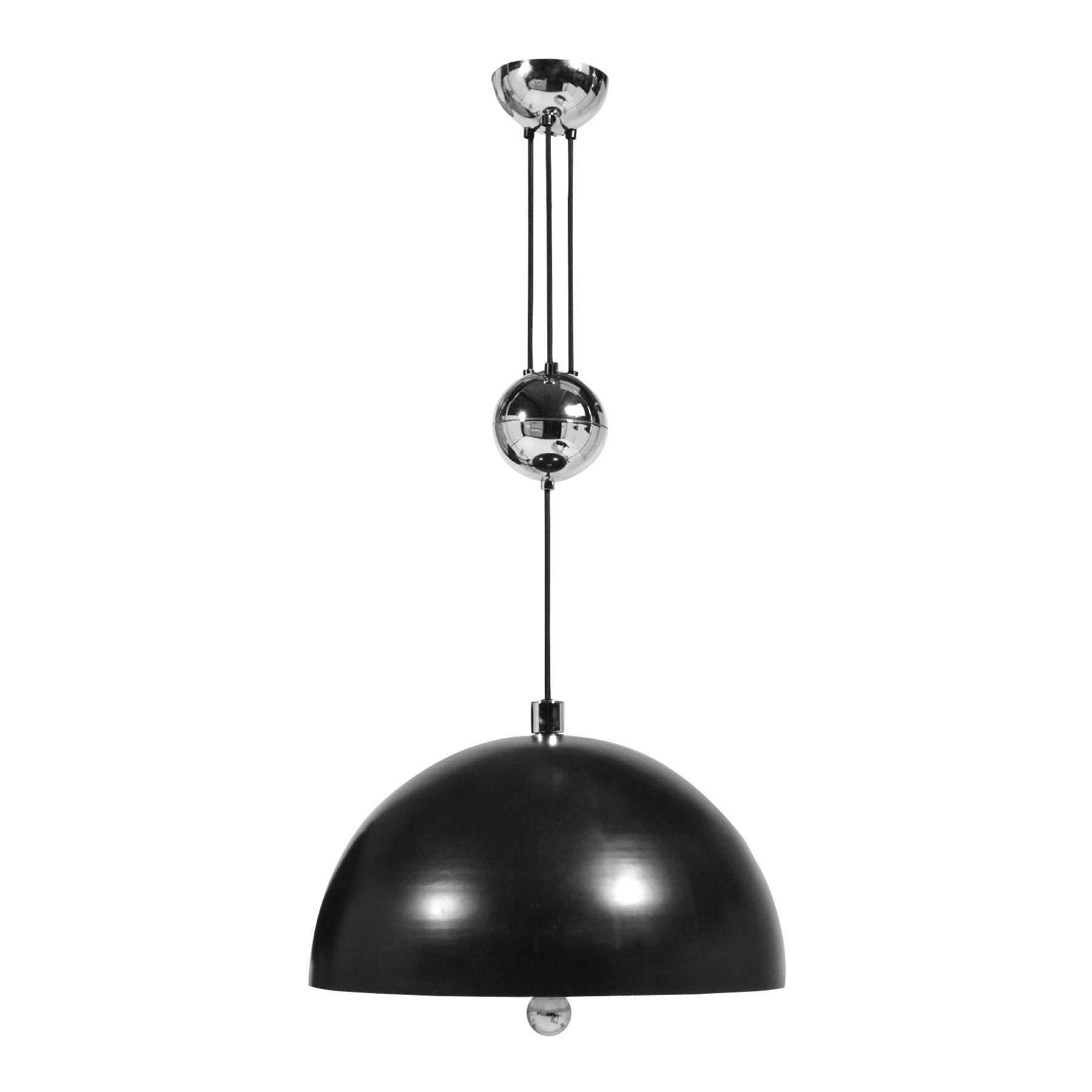This striking pendant lamp by Florian Schultz is incredibly well made and very versatile with the adjustable drop. The substantial lamp features a wonderful round chrome pull handle and a white Lucite bulb diffuser to prevent glare.

The shade is