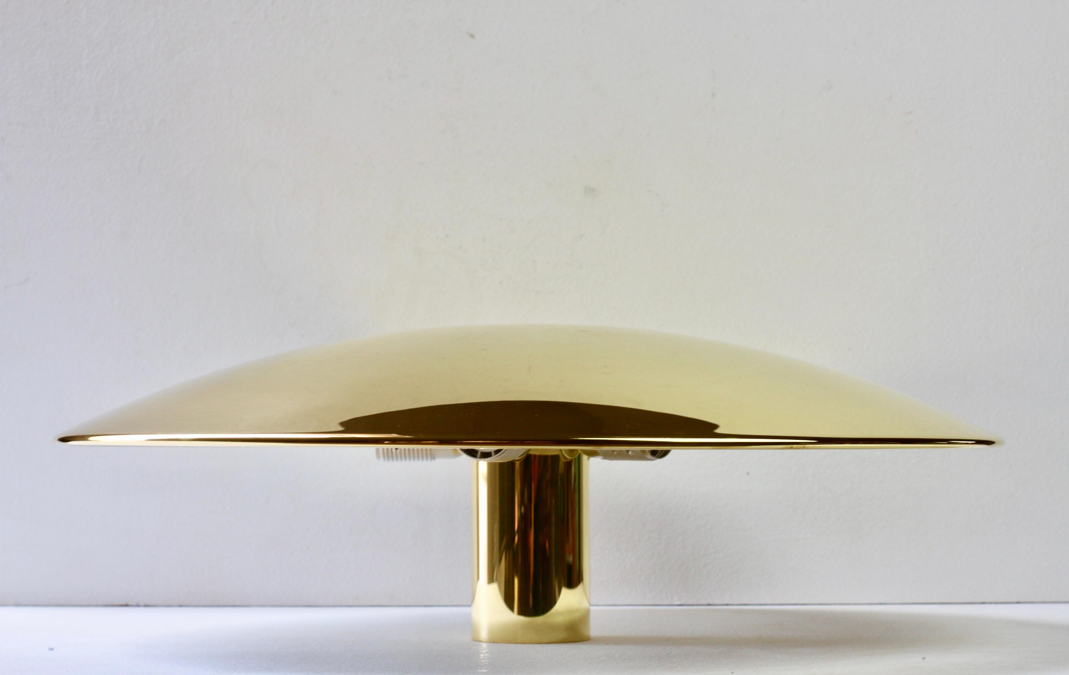 Brand new elegant Mid-Century Modern vintage design German made large polished brass hanging flush mount ceiling light or lamp model 'Sela 55' designed by Florian Schulz circa early 1970s. Featuring a lacquered polished brass circular round disc -