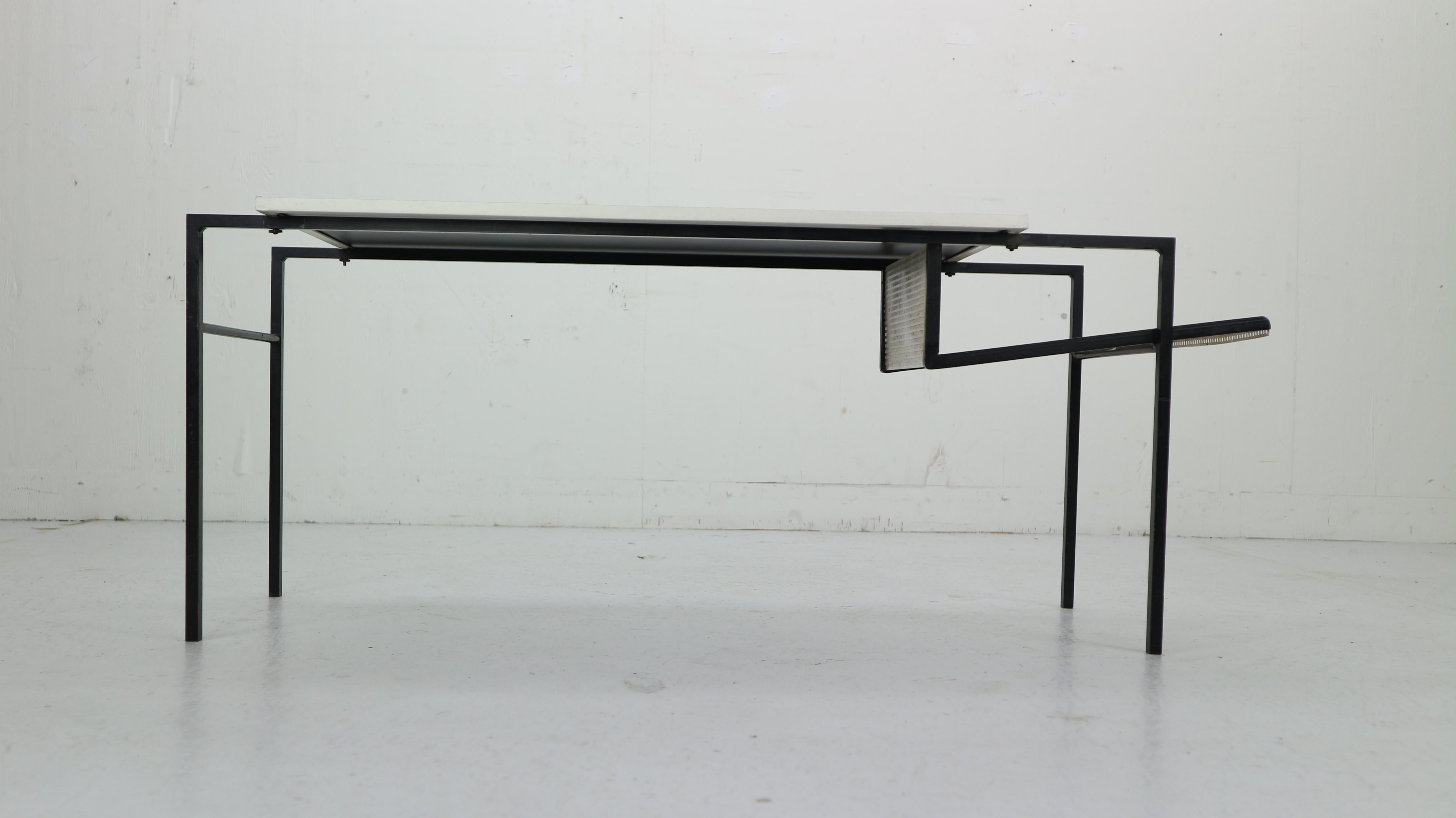 Coffee table or magazine table designed by Floris Fiedeldij for Artimeta Soest, Holland, 1955. This rare table has a solid steel frame, black lacquered. A black glass top and a die cut magazine rack. The table is in original condition. A fantastic