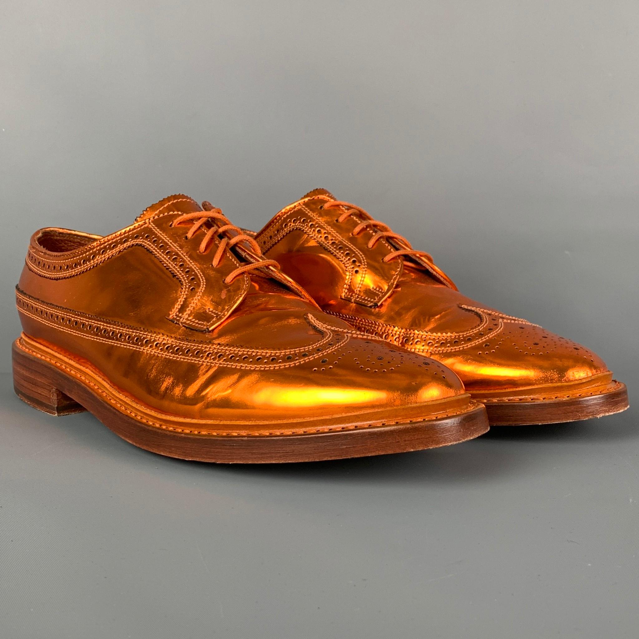 FLORSHEIM for DUCKIE BROWN shoes comes in a copper metallic leather featuring a wingtip style and a lace up closure. Includes box. 

Very Good Pre-Owned Condition.
Marked: 11

Outsole: 13 in. x 4.5 in. 