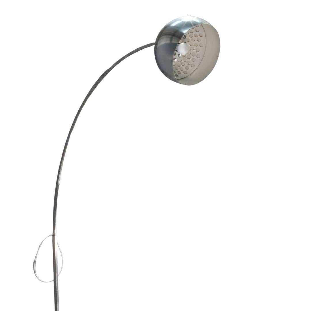 The Flos Arco Floor Lamp is a timeless piece of lighting design. Designed by Achille Castiglioni, this iconic lamp features a sleek, curved arm and a sturdy marble base, providing both functional illumination and a striking aesthetic statement.

