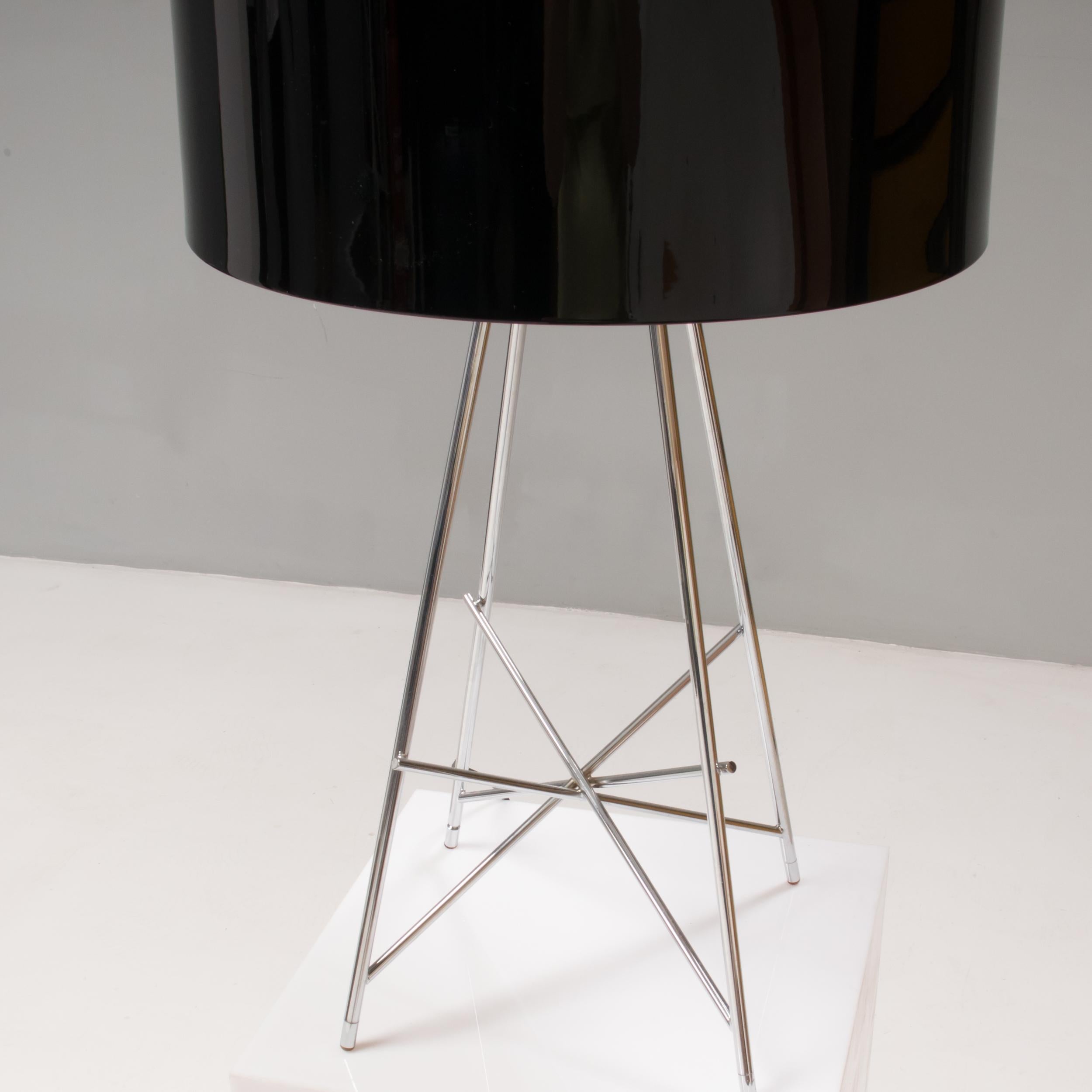 Constructed from a chrome plated steel tubular structure that creates an angular base, the table lamp features a black lamp shade.

The cable has an electronic dimmer which allows the brightness to be controlled.

A stylish lighting solution for