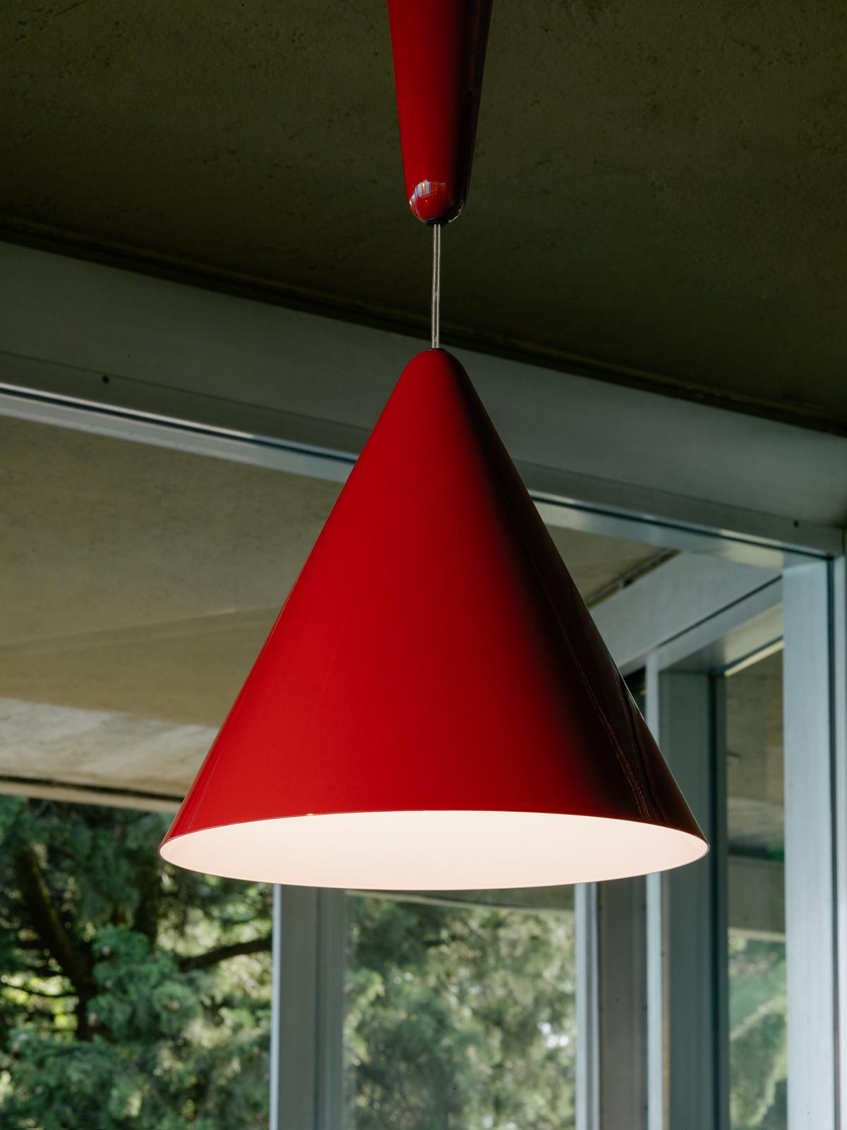 Pendant light with direct lighting designed by A. Castiglioni, composed of a ceiling rose and diffuser. Body in aluminium with external paint in 3 different colour options (shiny white, beaver brown, and cherry red), while the inside of the diffuser