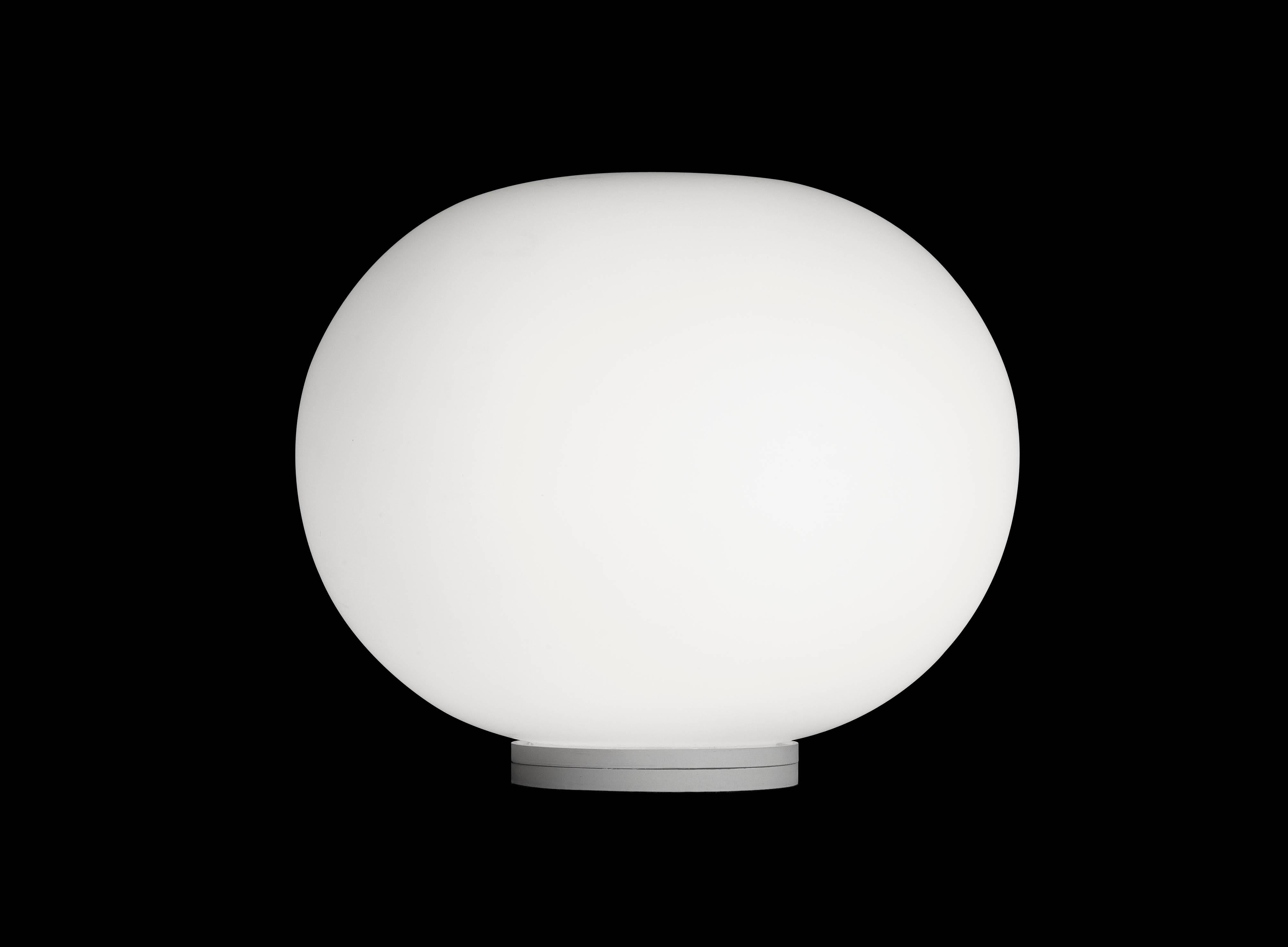FLOS Glo-Ball Basic Zero Table Lamp by Jasper Morrison
Part of the popular Glo Ball Series, the Glo Ball Basic was created in 1998 by artist Jasper Morrison to invoke the radiant calm of a full moon. This unique table lamp has a white acid-etched