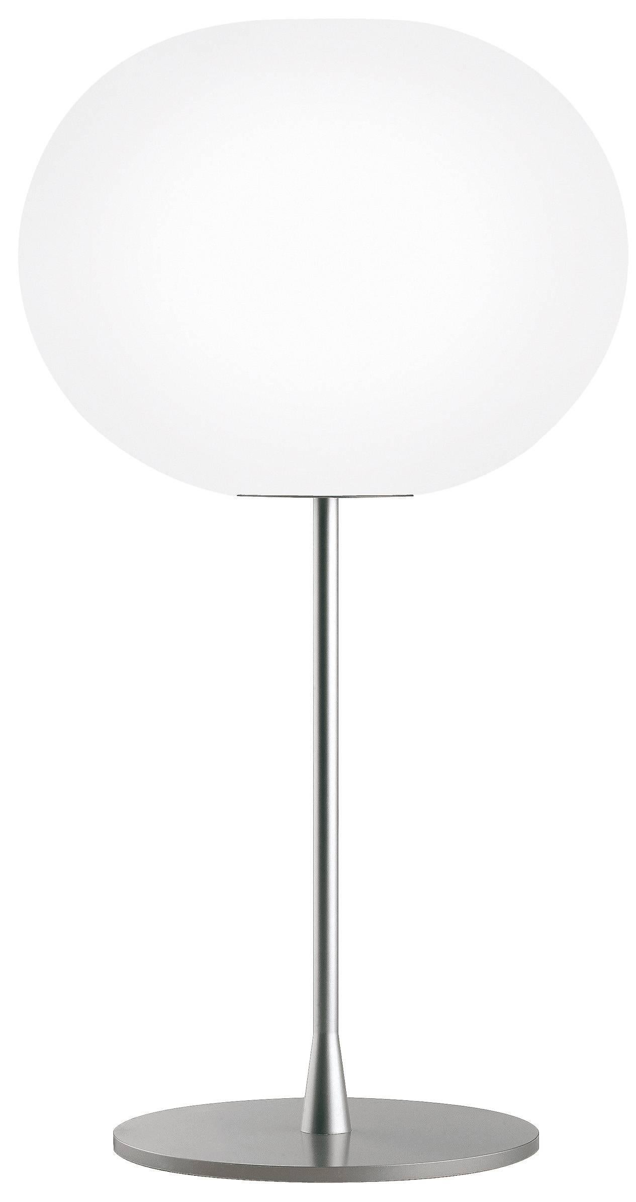 FLOS Glo-Ball T2 Halogen Table Lamp by Jasper Morrison
Part of the popular Glo Ball Series, the Glo Ball Basic was created in 1998 by artist Jasper Morrison to invoke the radiant calm of a full moon. This unique table lamp has a white acid-etched