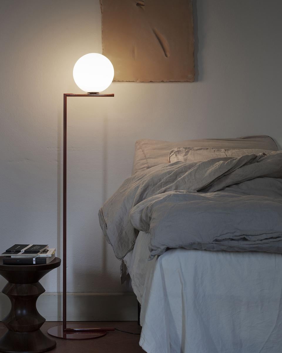 The IC Lights F floor lamp is an amazing amalgamation of light and balance. This indoor contemporary floor lamp has a blown opaline glass diffuser and the body is finished with brassed or chrome steel. It also comes with a dimmer on the power chord.