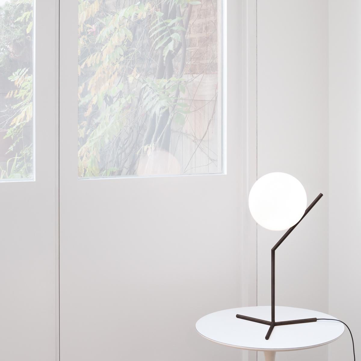 FLOS IC Lights T1 High Table Lamp in Black by Michael Anastassiades

Like the other pieces in his IC Light Series, the IC Lights T balances designer Michael Anastassiades’ love of industrial simplicity with intricate symbolism. It provides diffused