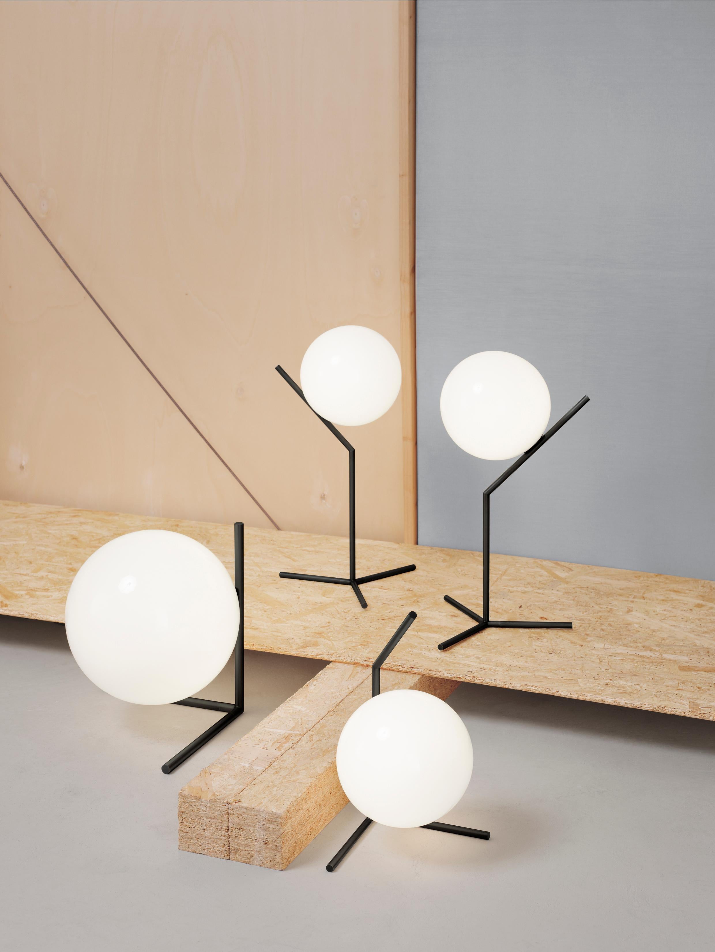 FLOS IC Lights T1 Low Table Lamp in Black by Michael Anastassiades

Like the other pieces in his IC Light Series, the IC Lights T balances designer Michael Anastassiades’ love of industrial simplicity with intricate symbolism. It provides diffused