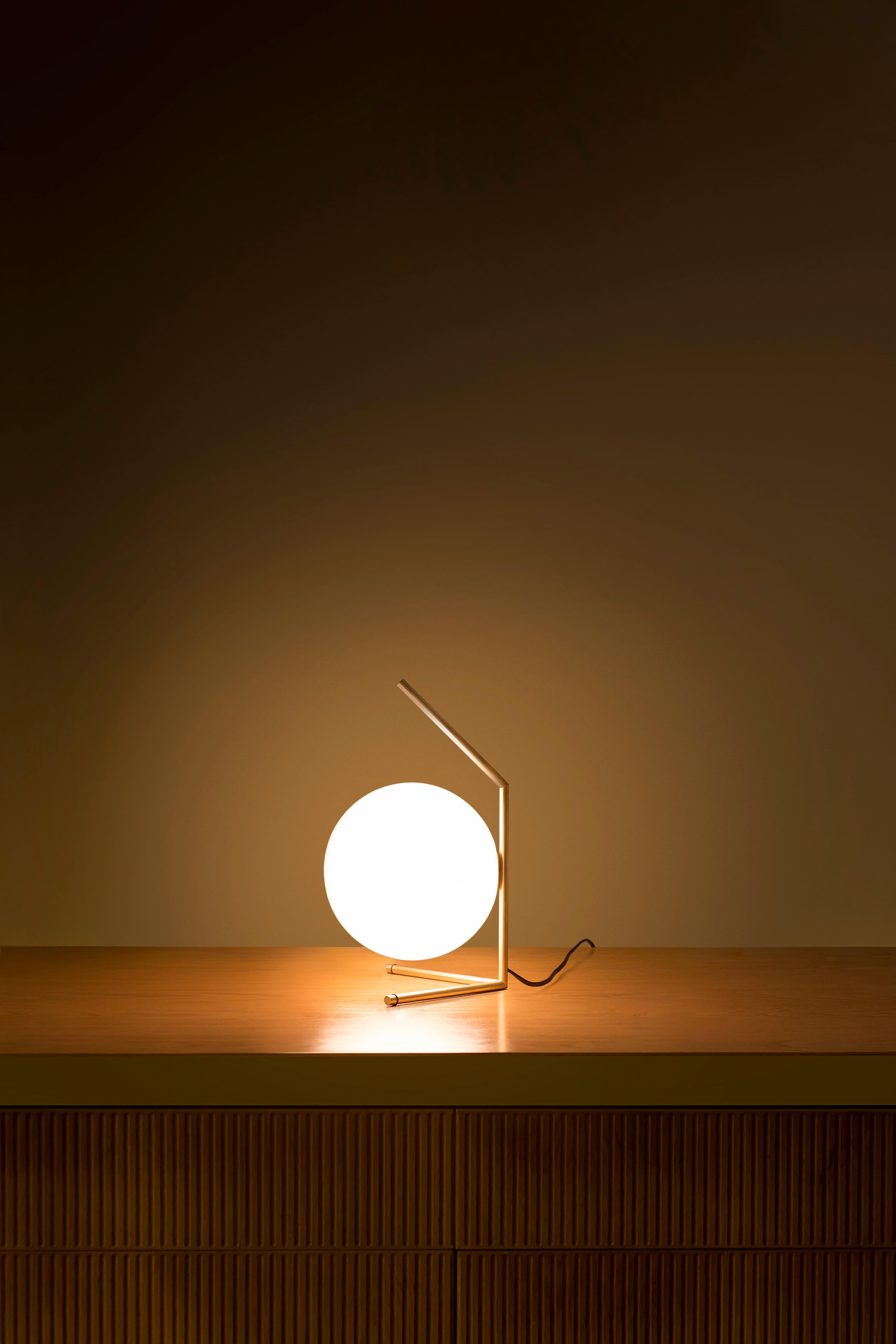 FLOS IC Lights T1 Low Table Lamp in Brass by Michael Anastassiades

Like the other pieces in his IC Light Series, the IC Lights T balances designer Michael Anastassiades’ love of industrial simplicity with intricate symbolism. It provides diffused