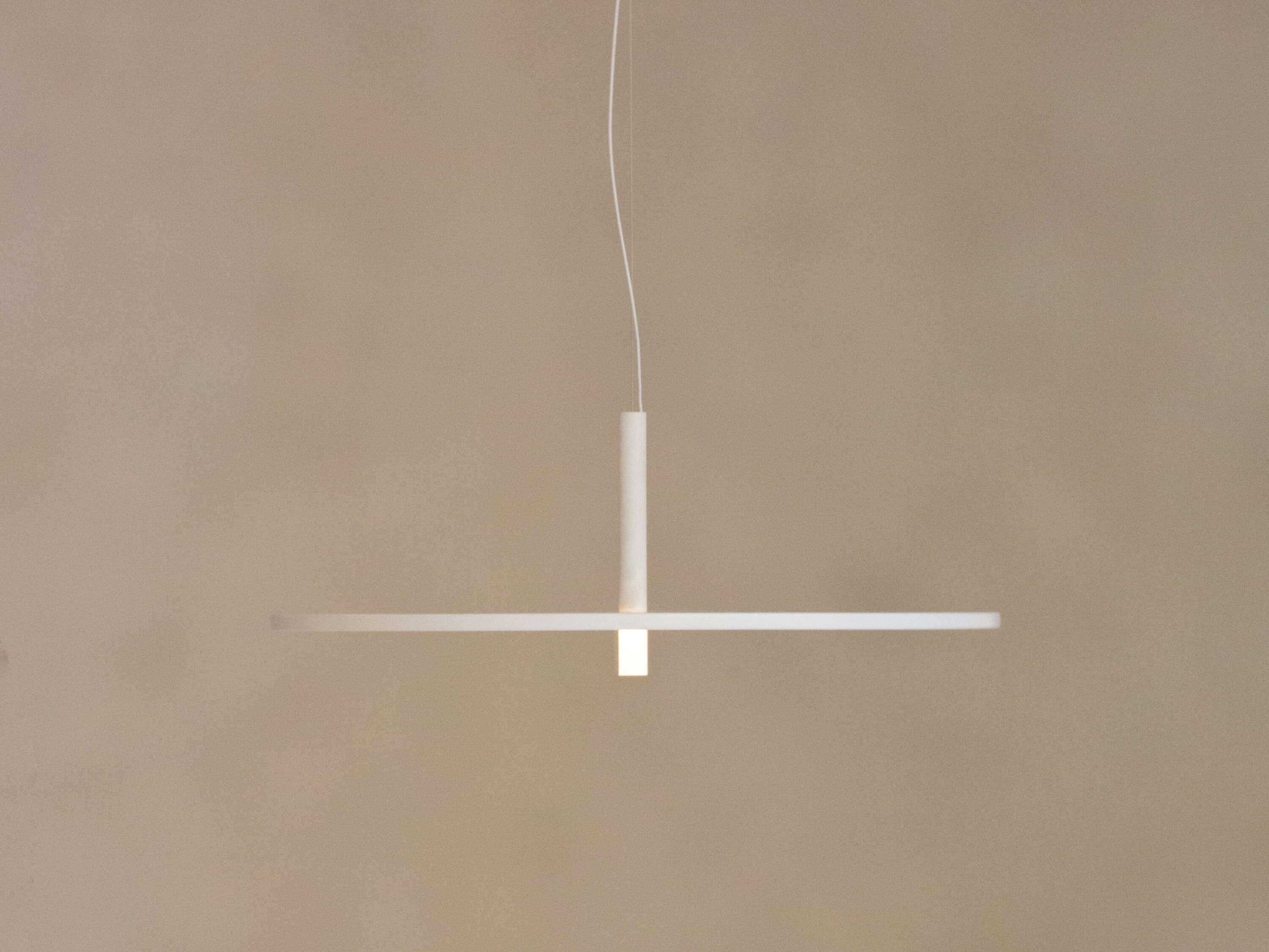 Flos My Disc Suspended Lamp of Aluminum and Polycarbonate in Matt White Color by Michael Anastassiades

My Circuit Disc is a a suspended lamp with diffused light composed of a slender horizontal disc crossed by a vertical stem with a refined balance