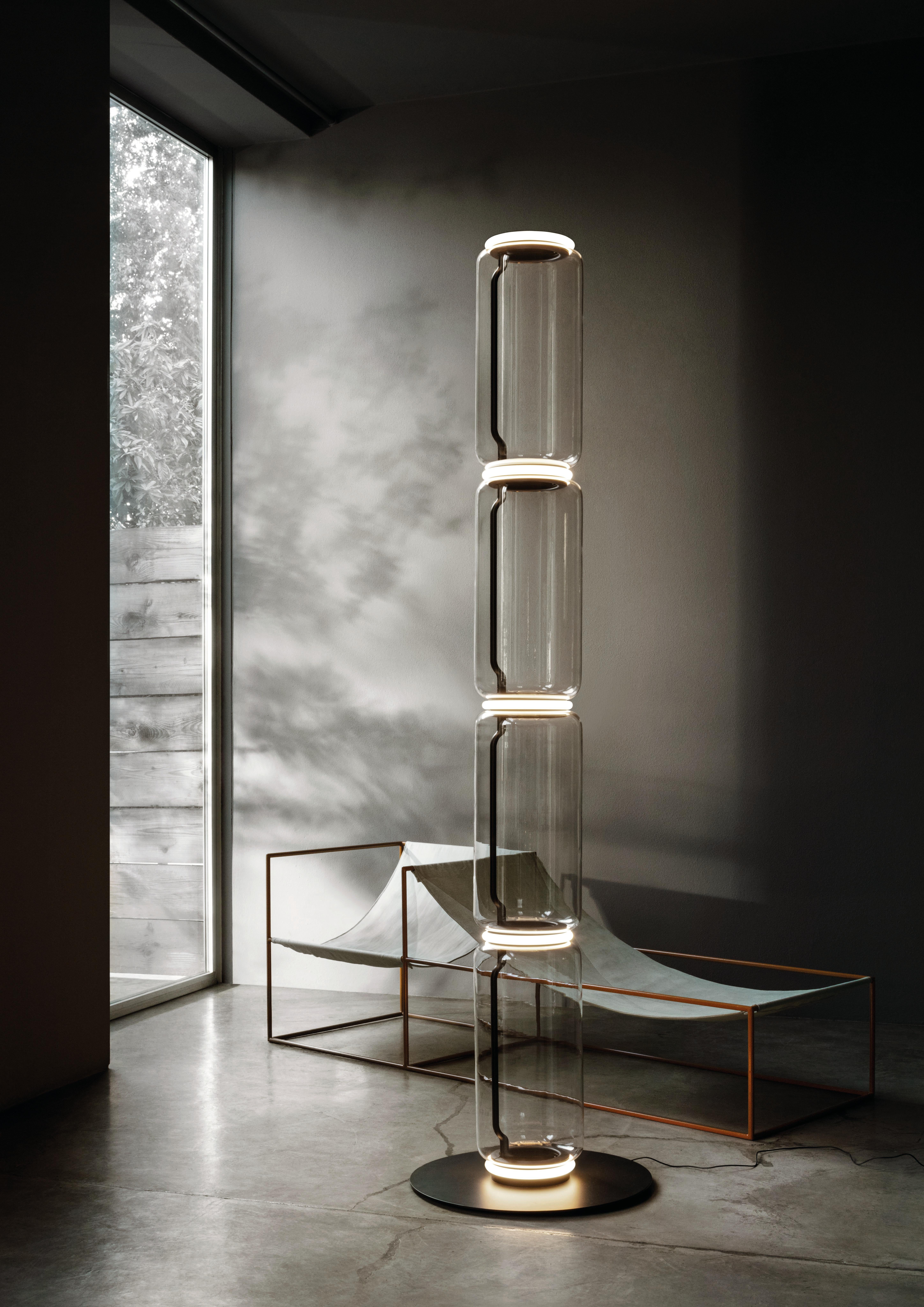 The brainchild of master designer Konstantin Grcic, Noctambule by Flos is a futuristic lighting system that blends innovation, efficiency and aesthetics. Its transparent hand blown glass cylinder is surrounded by discrete LED technology on top and