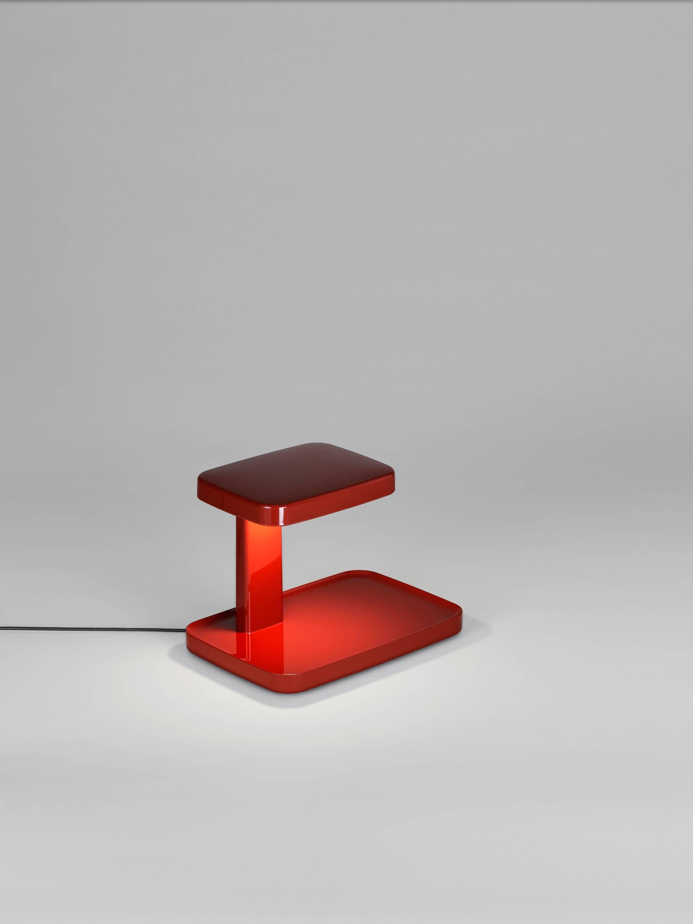 What will you shine the light on? Created by Ronan and Erwan Bouroullec, the flat base of the Piani takes the feel of a stage when a triangular beam of light—like a spotlight—shines on whatever is placed upon it.

The top of the lamp, like the