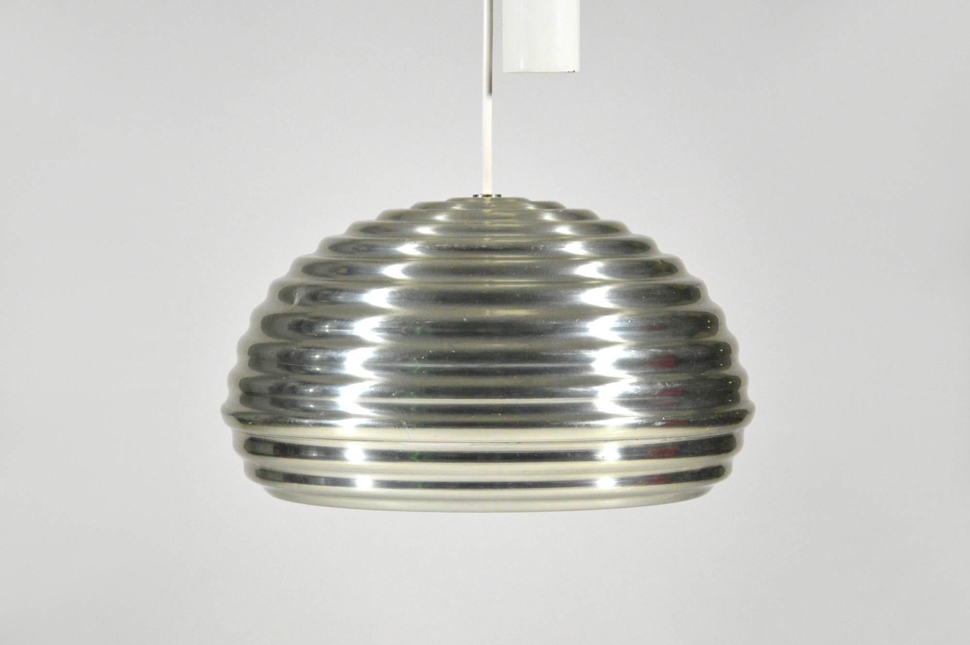 Rare version with up and down mechanism of the famous Splügen Bräu pendant lamp, designed by Achille and Piergiacomo Castiglioni in 1961 for a brasserie in Milan, and produced by Flos.
This is an early version in good original condition with some