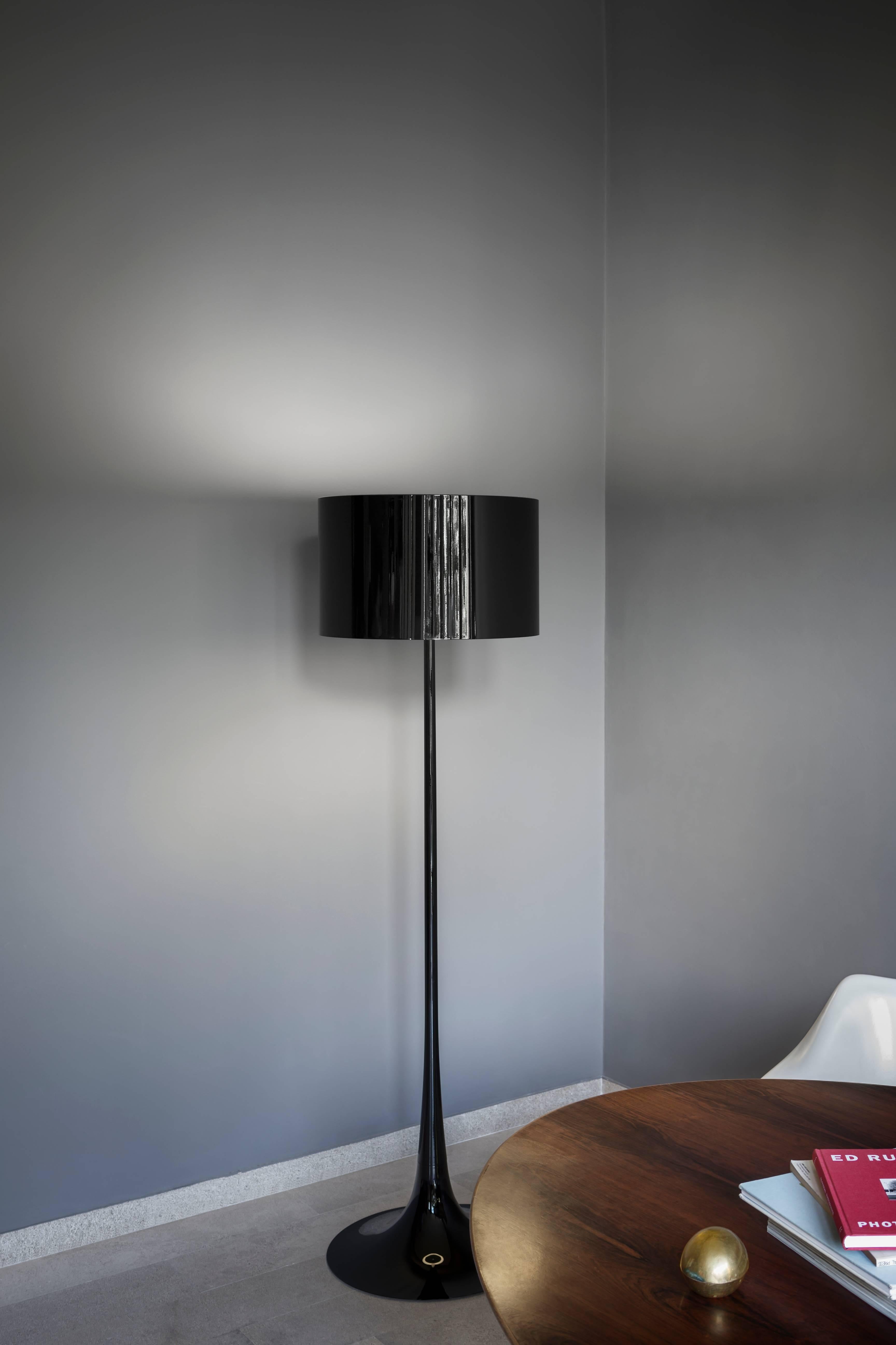 Designed by Sebastian Wrong in 2003, the Spun Light-F floor lamp reflects the best of modern manufacturing technology combined with elegance, craftsmanship, and dynamic fluid aesthetics.

Its main body has a spun metal frame and diffuser. The