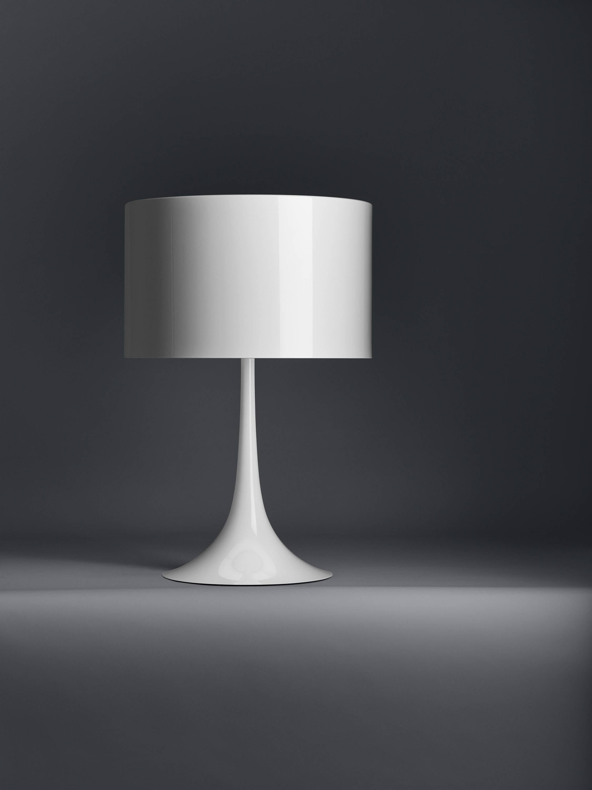 Designed by Sebastian Wrong in 2003, the Spun Light-T table lamp reflects the best of modern manufacturing technology combined with elegance, craftsmanship, and dynamic fluid aesthetics.

Its main body has a spun metal frame and diffuser. The
