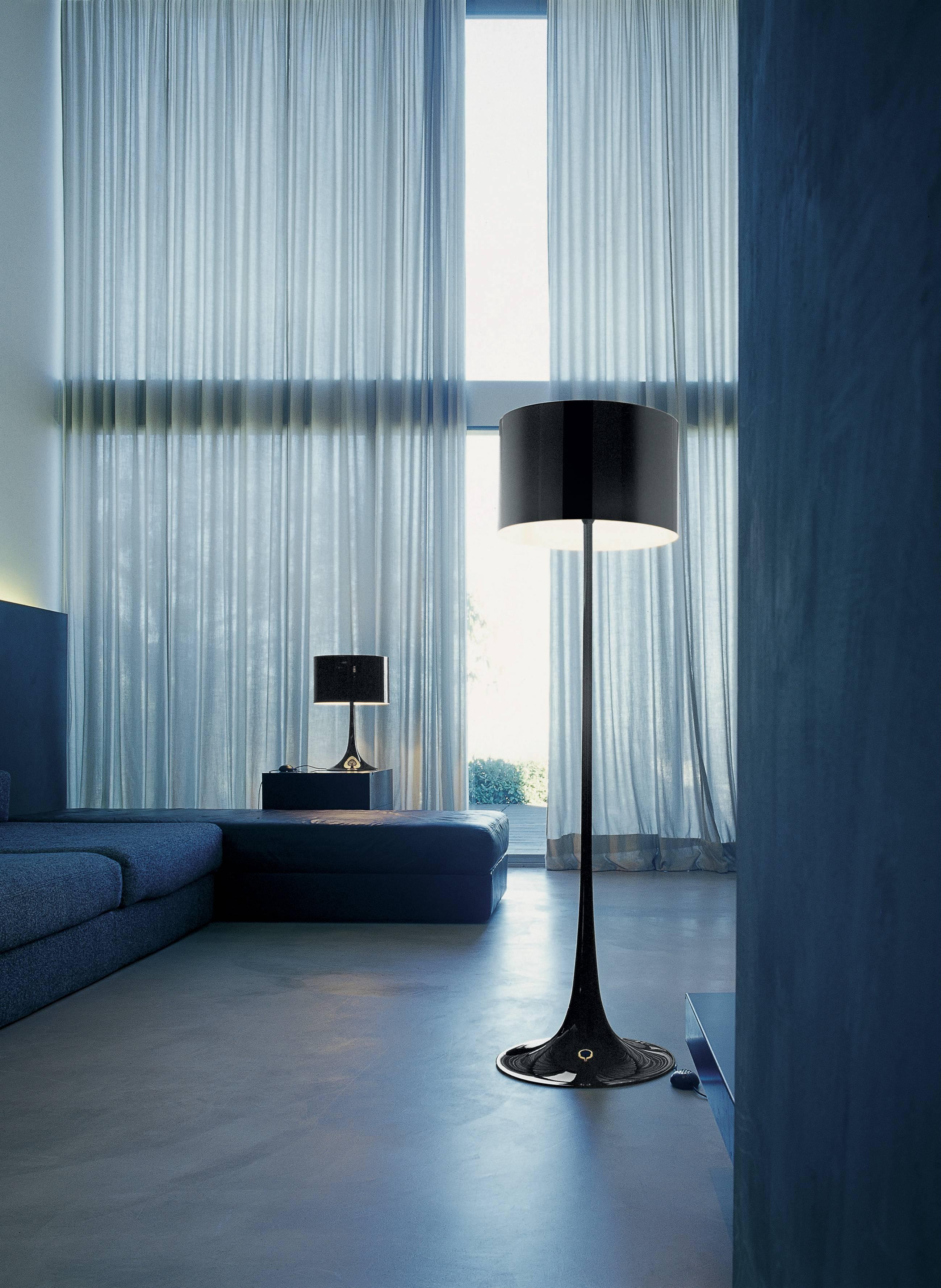 Designed by Sebastian Wrong in 2003, the Spun Light-T table lamp reflects the best of modern manufacturing technology combined with elegance, craftsmanship, and dynamic fluid aesthetics.

Its main body has a spun metal frame and diffuser. The