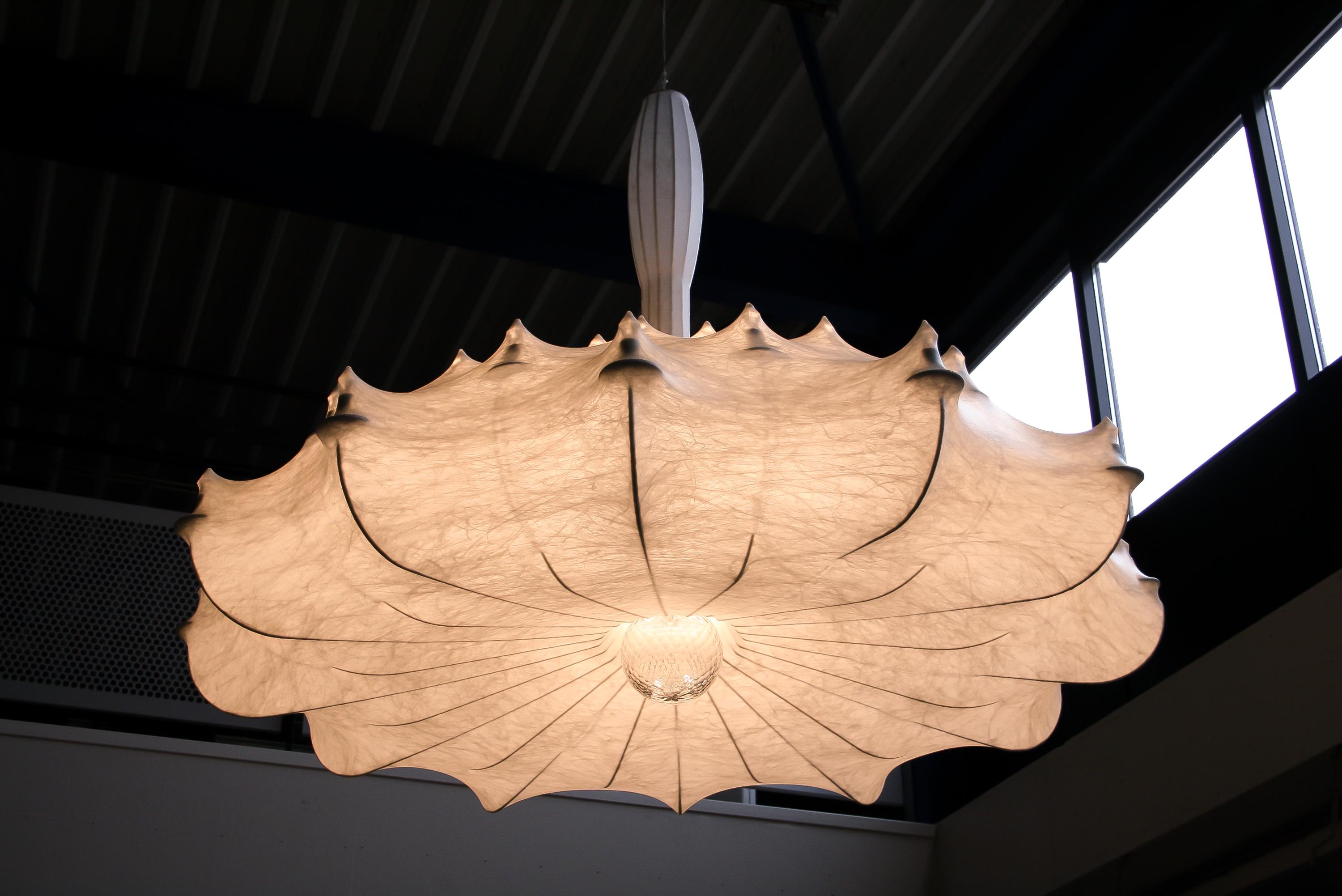 Large pendant providing diffused lighting. White powder coated internal steel structure sprayed with a unique “cocoon” resin. Transparent polymethylmethacrylate “candles.” Faceted crystal globe located at the lower centre for a sparkle effect.