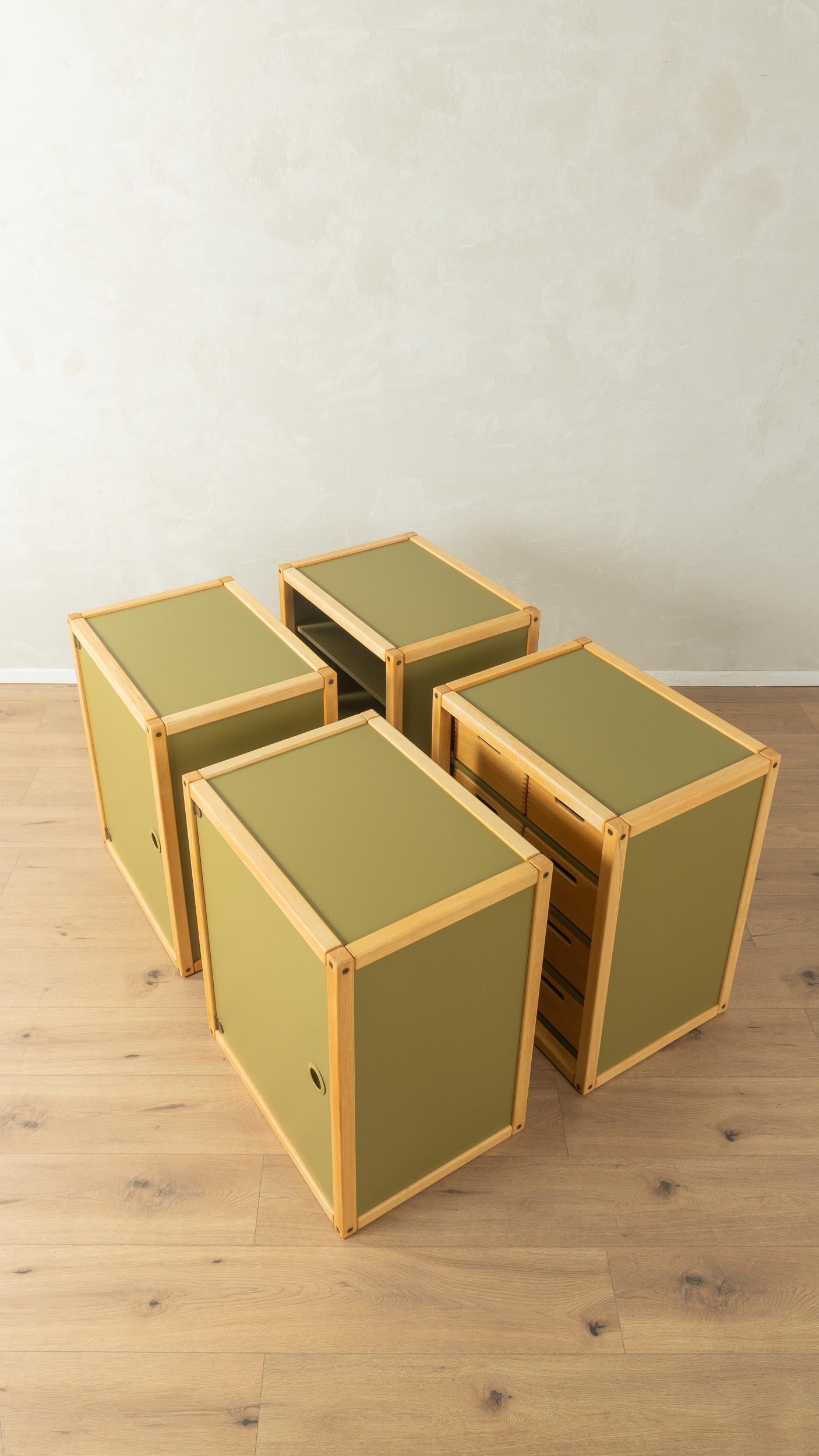 Four-part profile system by Flötotto from the 1970s. The system consists of two containers, each with one door and one shelf, one open container with two shelves and one container with eight drawers. Frames and drawers made of solid beech and