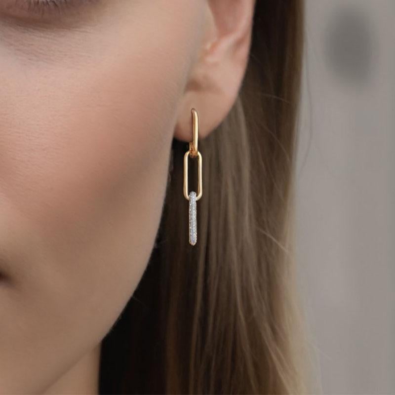These stunning Flow Diamond 14K Yellow Gold Danglers Drop Earrings feature natural diamonds with a total carat weight of 0.70CT. Weighing 8 grams, they offer an elegant flow and brilliant sparkle, perfect for any special occasion. The dangler design