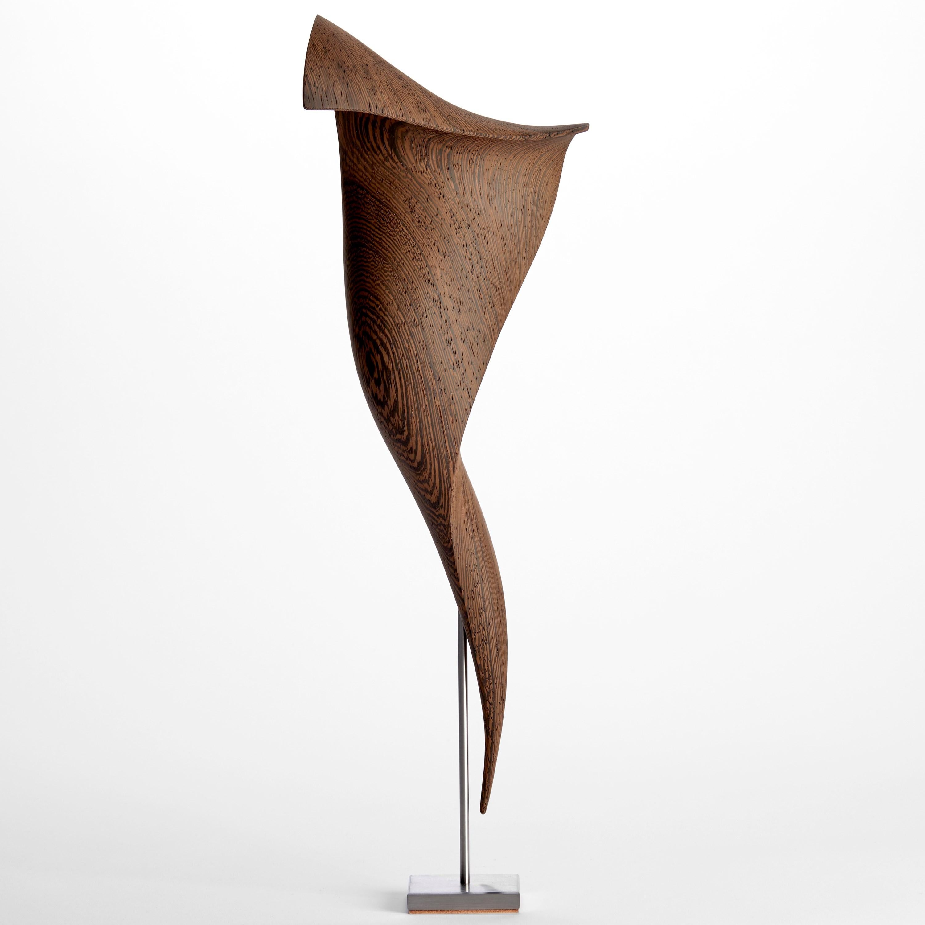 'Flow Petit No 22' is a unique artwork by the Danish artists, Egeværk. It is created from Wengé sourced from Africa - Congo and Cameroon - (wood, FSC* certified) with a stainless steel foot. Signed on the base.

The Flow Series created by Egeværk