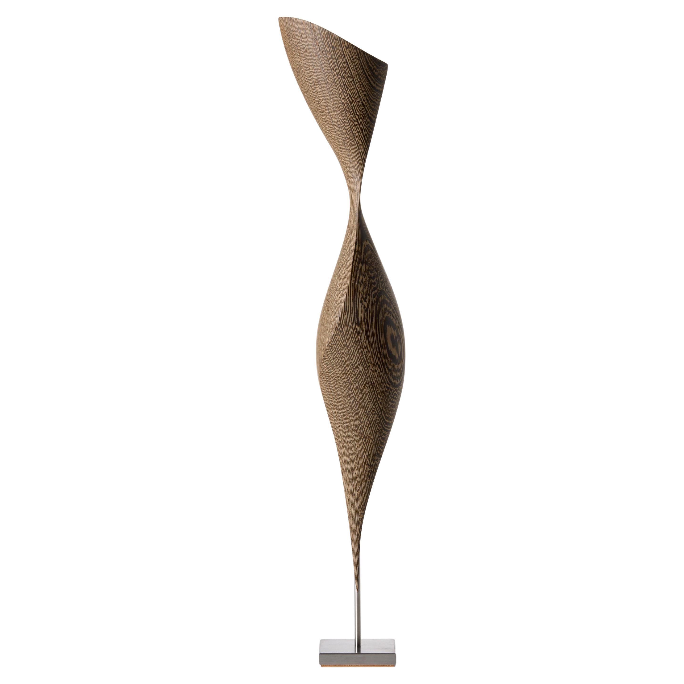 Flow Petit No 27, abstract fluid Wenge wood
steel mounted sculpture by Egeværk