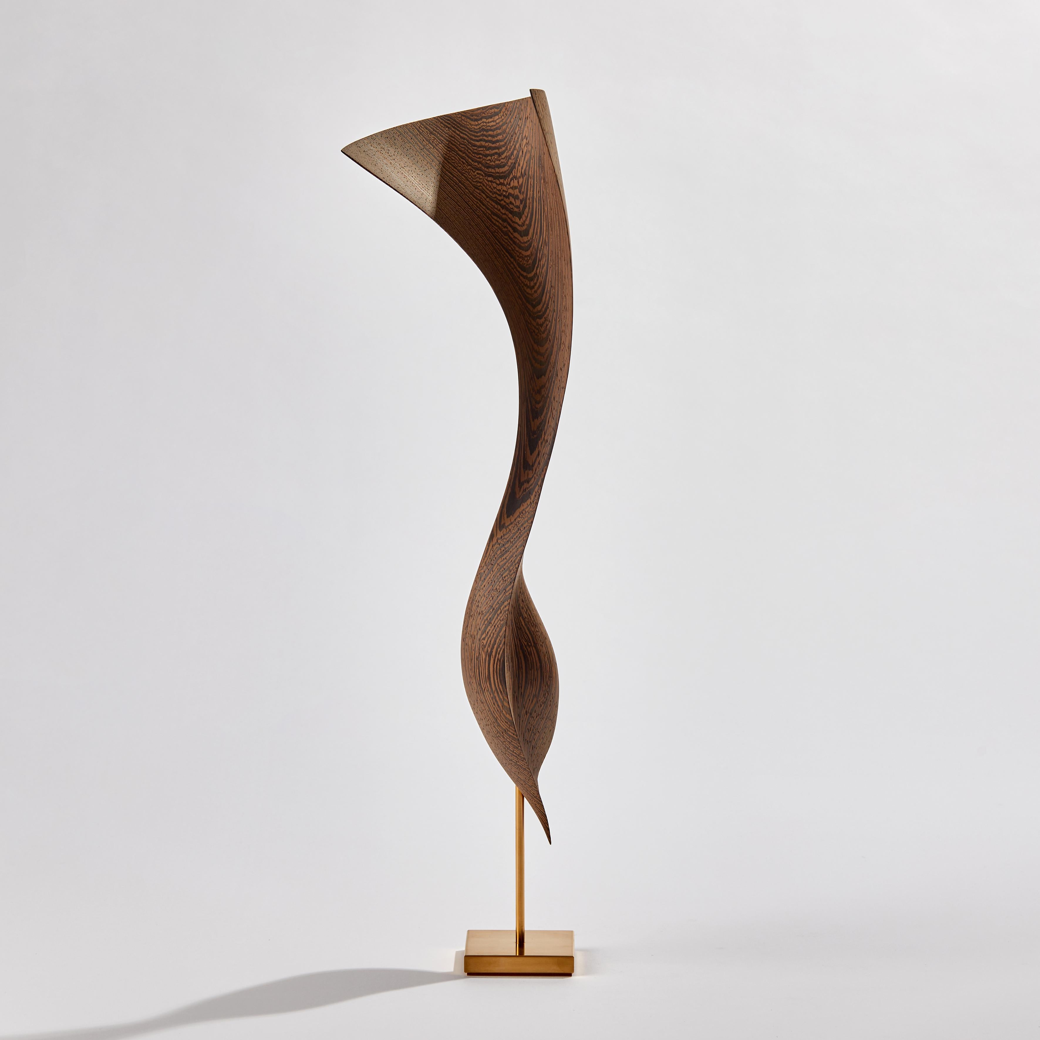 Flow Petit No 9 is a unique handcrafted sculpture by the Danish artists, Egeværk. Created from Wengé sourced from Africa - Congo and Cameroon - (wood, FSC* certified) with an inlay of 24ct fine gold and gold plated stainless steel foot. Signed on