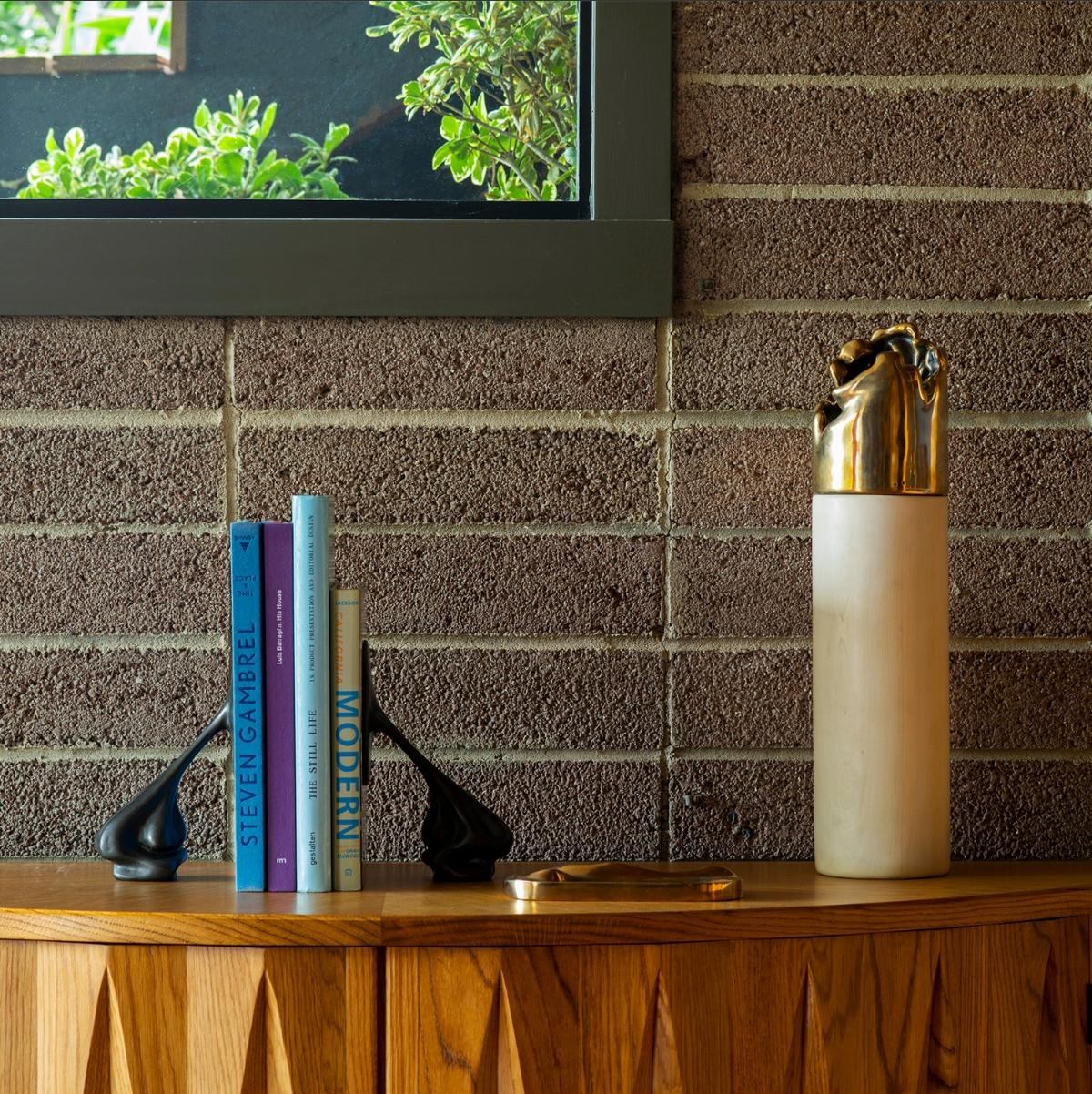 Turned wood and cast bronze made in Los Angeles.  Design is inspired by the the natural flows of water. 