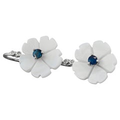 Flower 14k gold earrings with blue sapphires. 