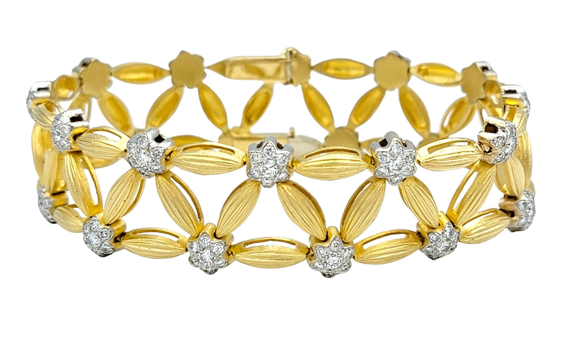 The inner circumference of this bracelet measures 7.13 inches and will comfortably fit up to a 7 inch wrist. 

This exquisite diamond flower and leaf bracelet, a masterpiece of elegance and grace. Crafted in lustrous 18 karat yellow gold, this