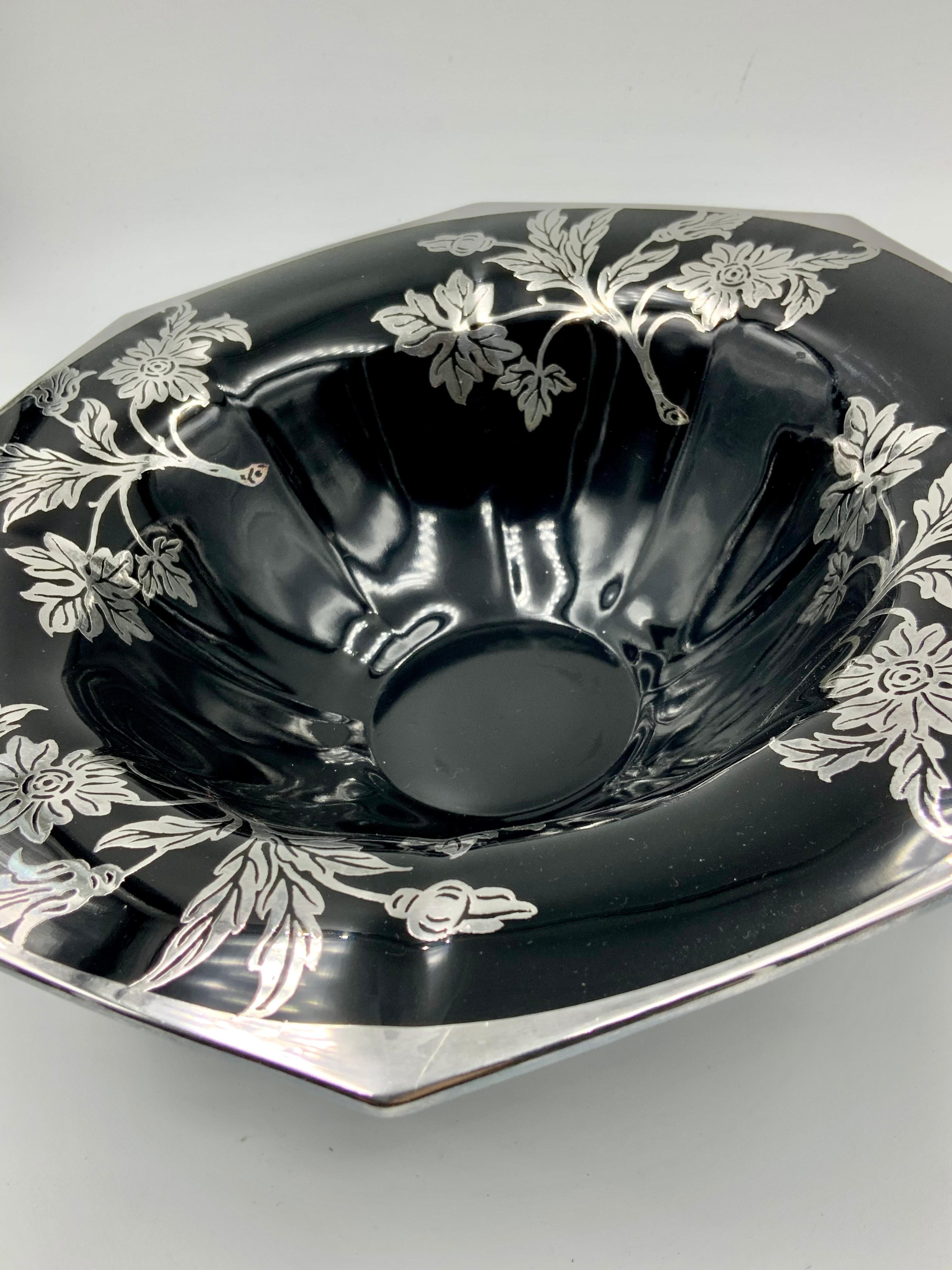 Beautiful octagonal black / amethyst glass bowl with flower and leaf sterling silver over lay design. The bottom has 4 feet.