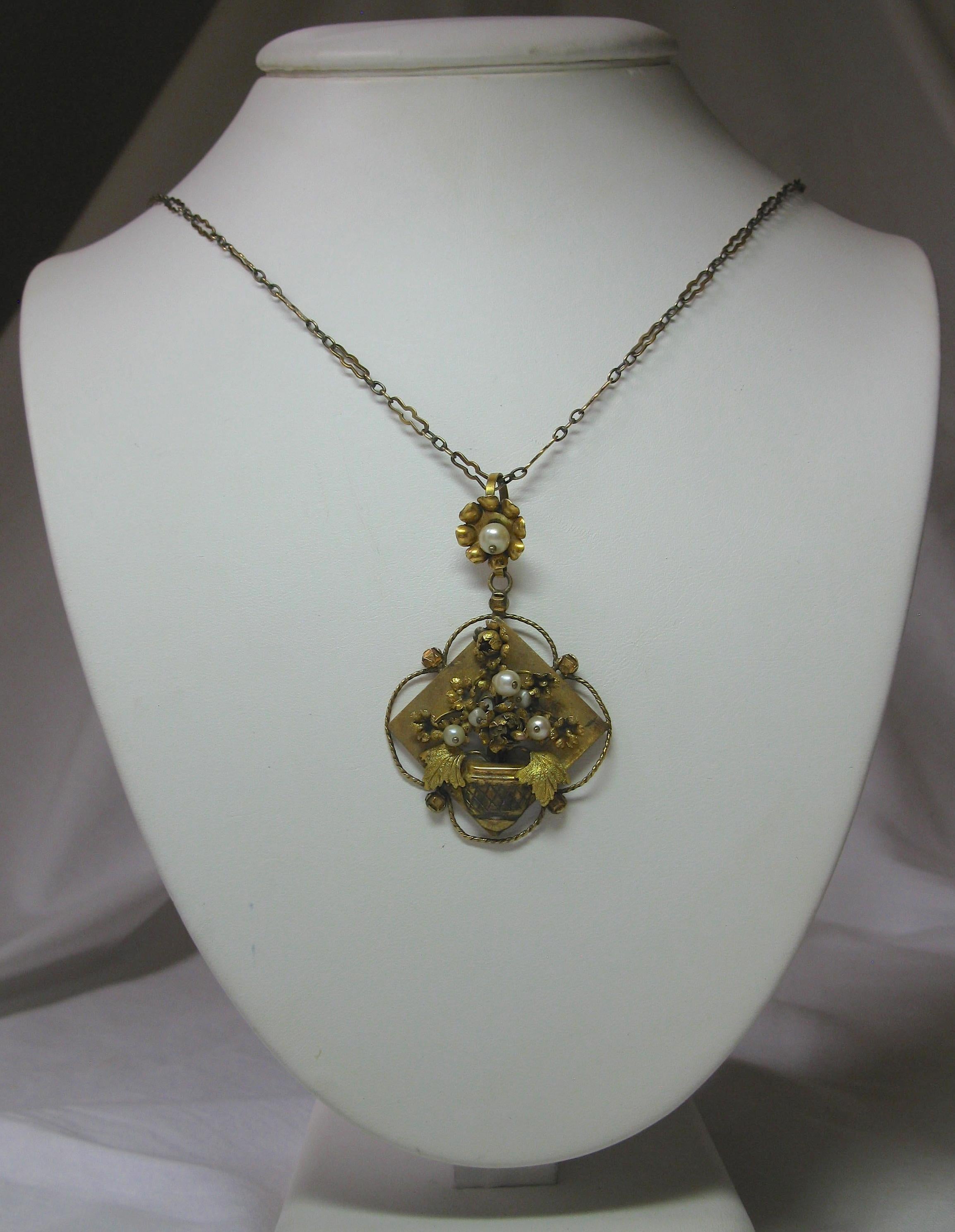 A very rare early antique Art Nouveau - Belle Epoque pendant necklace with a gorgeous three dimensional flower basket motif on an original gold chain.  From the Tuscany region of Italy, probably Florence or Arezzo.   The stunning gold is 12 Karat