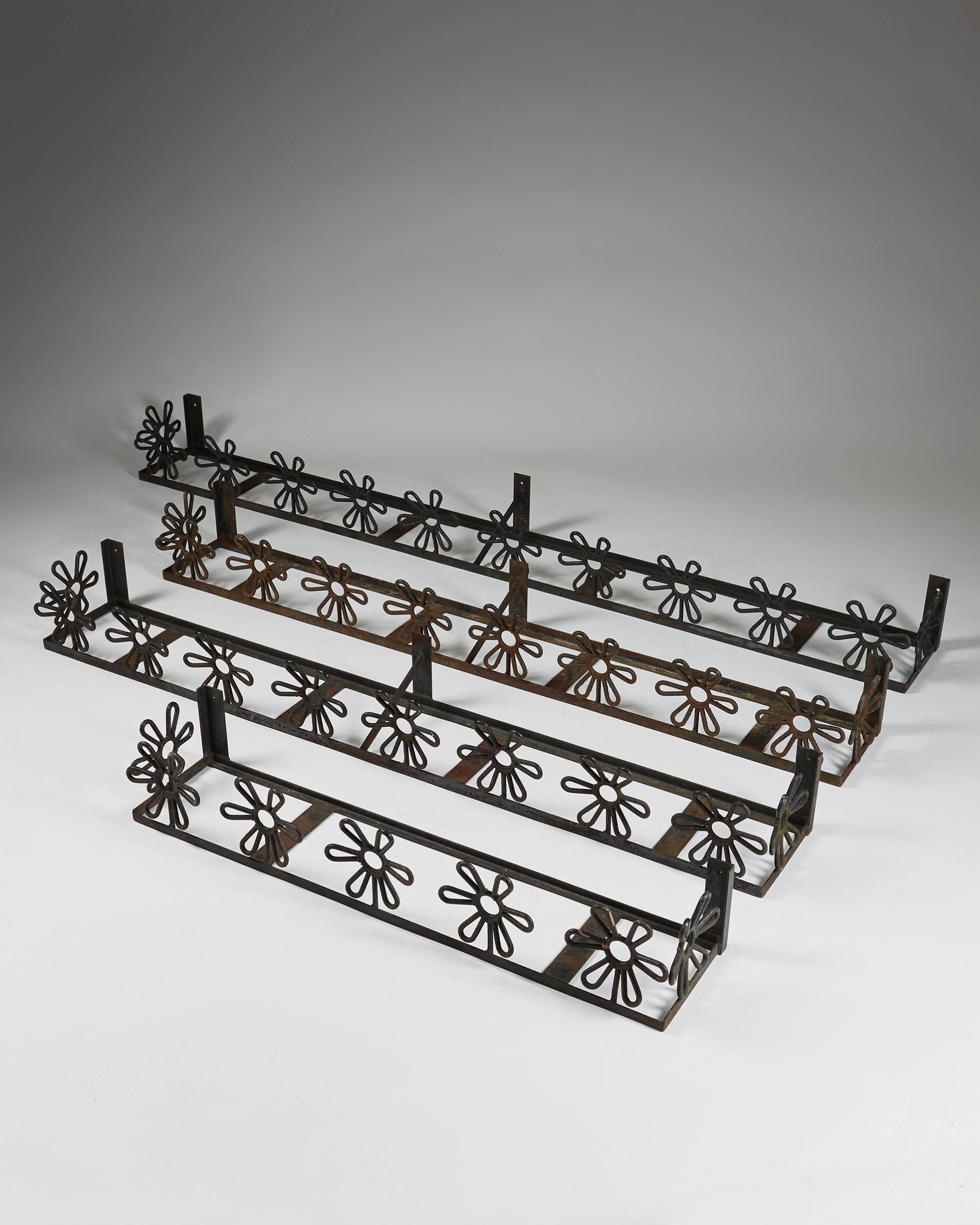 Flower boxes anonymous,
Sweden, 1950s.

Forged iron.

Measures: Length of the largest 186 cm/ 6' 1''
Height 16 cm/ 6 1/4''
Depth 21 cm/ 8 1/4''

Length of the medium sized 146 cm/ 4' 9 1/2''
Height 16 cm/ 6 1/4''
Depth 21 cm/ 8
