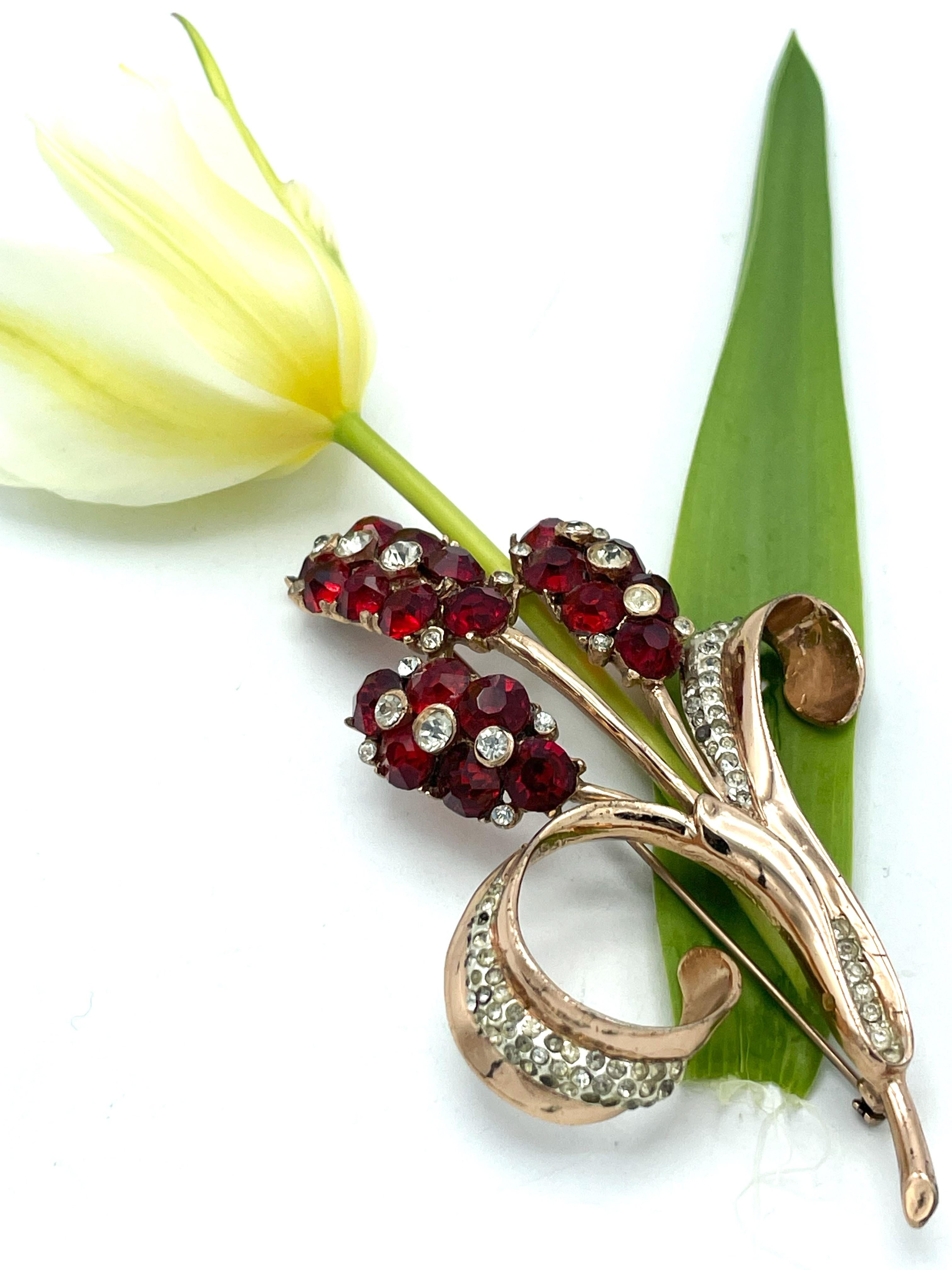 Very nice and in perfect condition Coro Craft Brooch with red larg rhinstones and over the leafs clear rhinstones too. 

Measurement 
Height  9,5 cm 
Width of the 3 red flowers 3.5 cm
Almost 4 cm wide from the round leaf to the stem.

Features
-