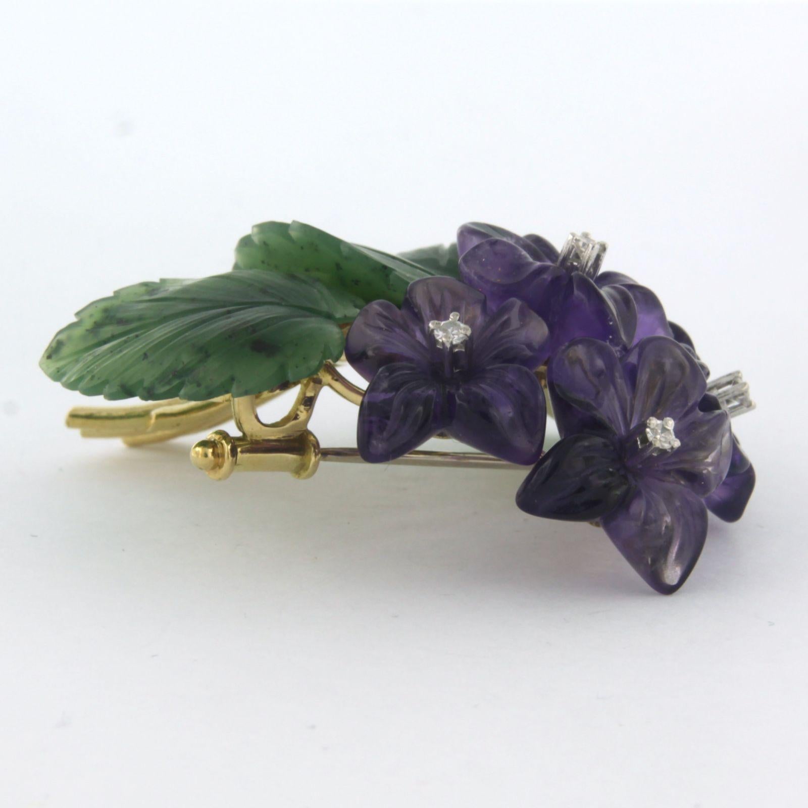 18k yellow gold brooch in the shape of a bouquet with amethyst, jade and single cut diamond. 0.03ct - F/G - VS/SI - dim. 4.6cm x 4.2cm

detailed description

the size of the brooch is 4.2 cm wide by 4.6 cm high and 1.5 cm deep

weight 18.7
