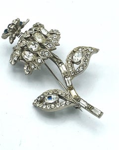Flower brooch with a small moving butterfly, rhinestones, rhodium, 1940 US
