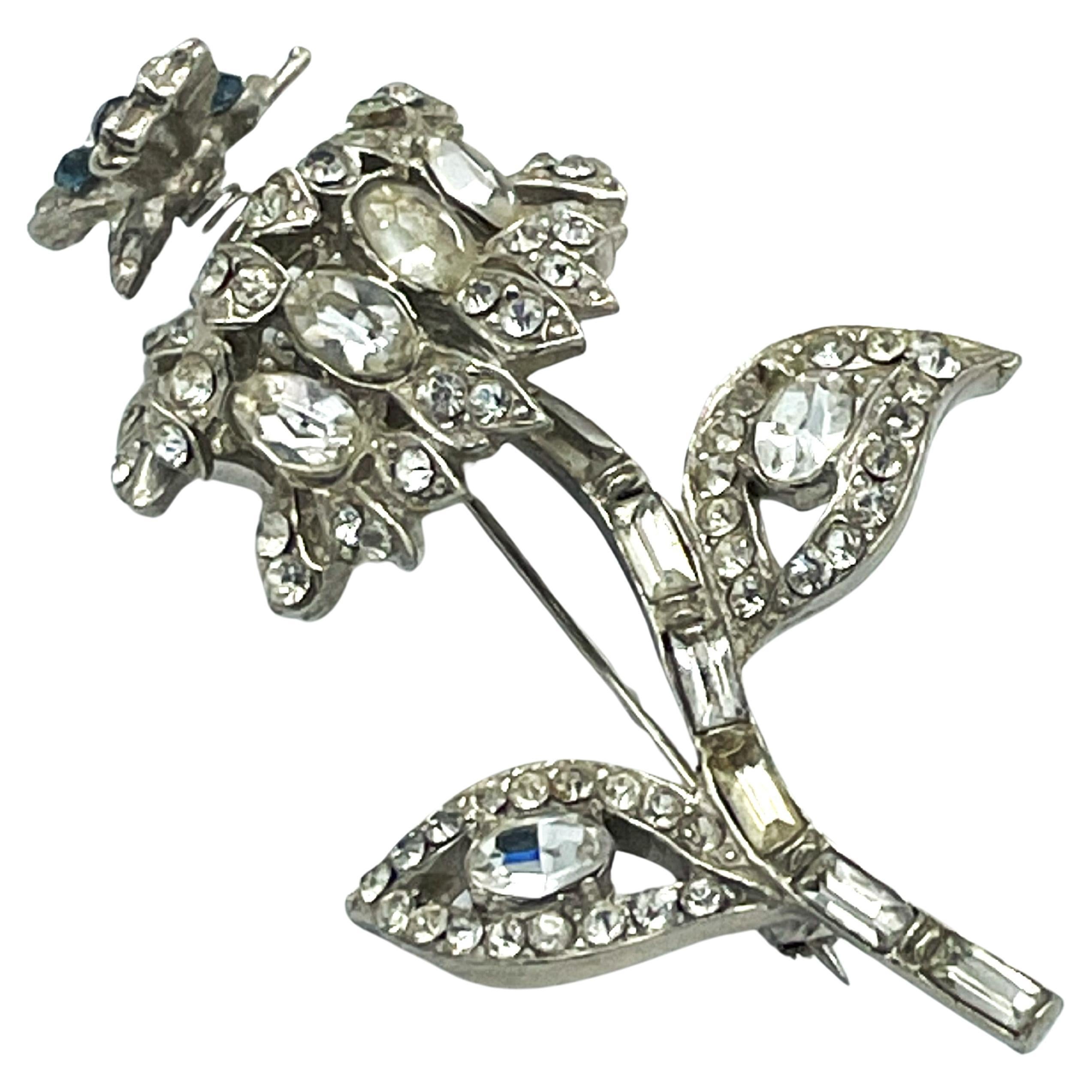  Flower brooch with a small moving butterfly, rhinestones, rhodium, 1940 US For Sale