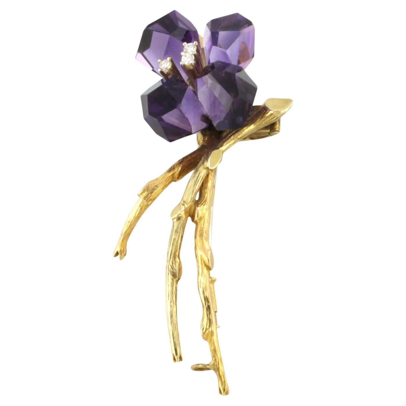 Flower brooch with amethyst and brilliant cut diamonds 18k bicolor gold